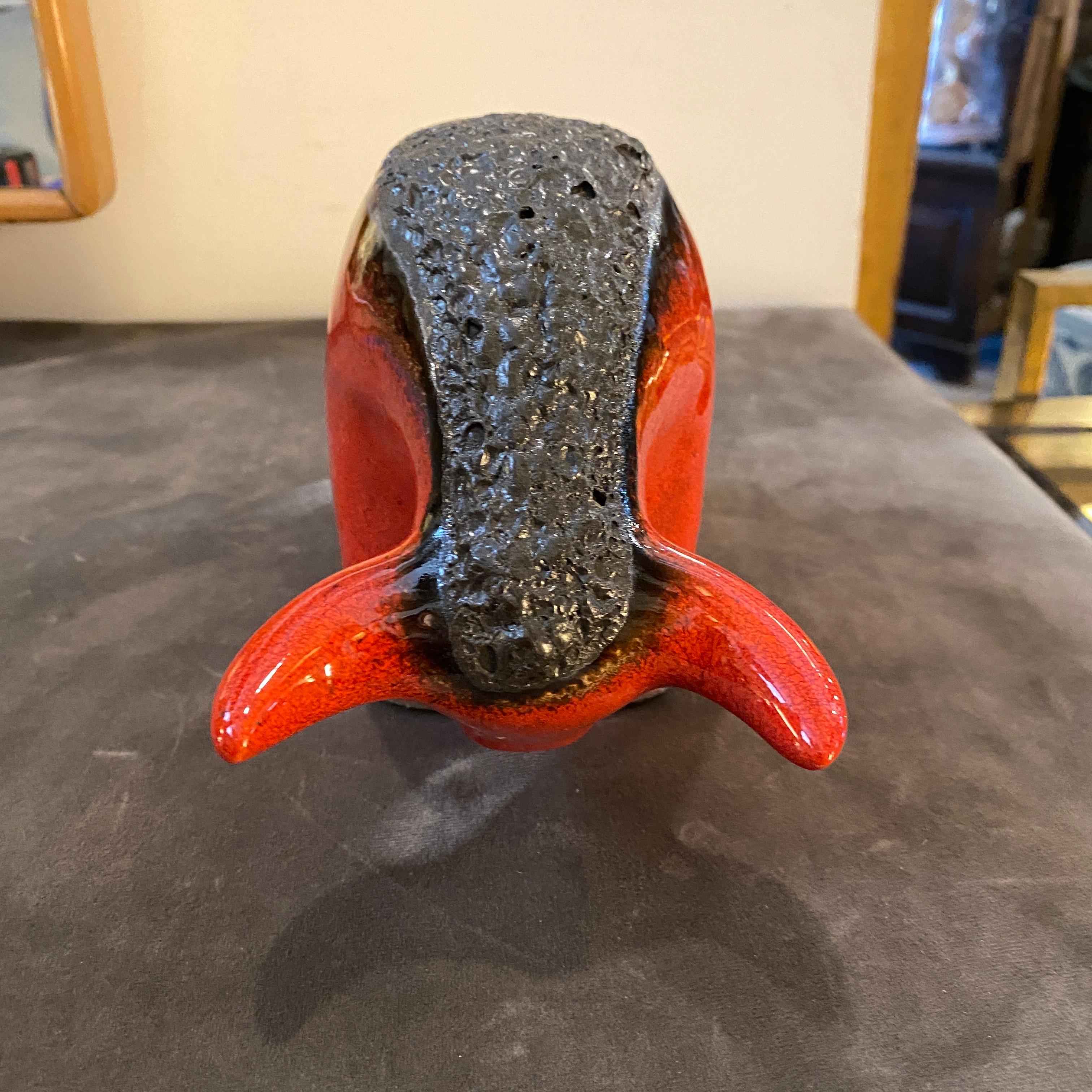 A stylish red and black ceramic bull made in Germany in the Seventies by Otto Keramik. Fat lava pottery takes its name from its resemblance to volcanic lava and was very popular in the Seventies all over the Europe. The bull it's in perfect