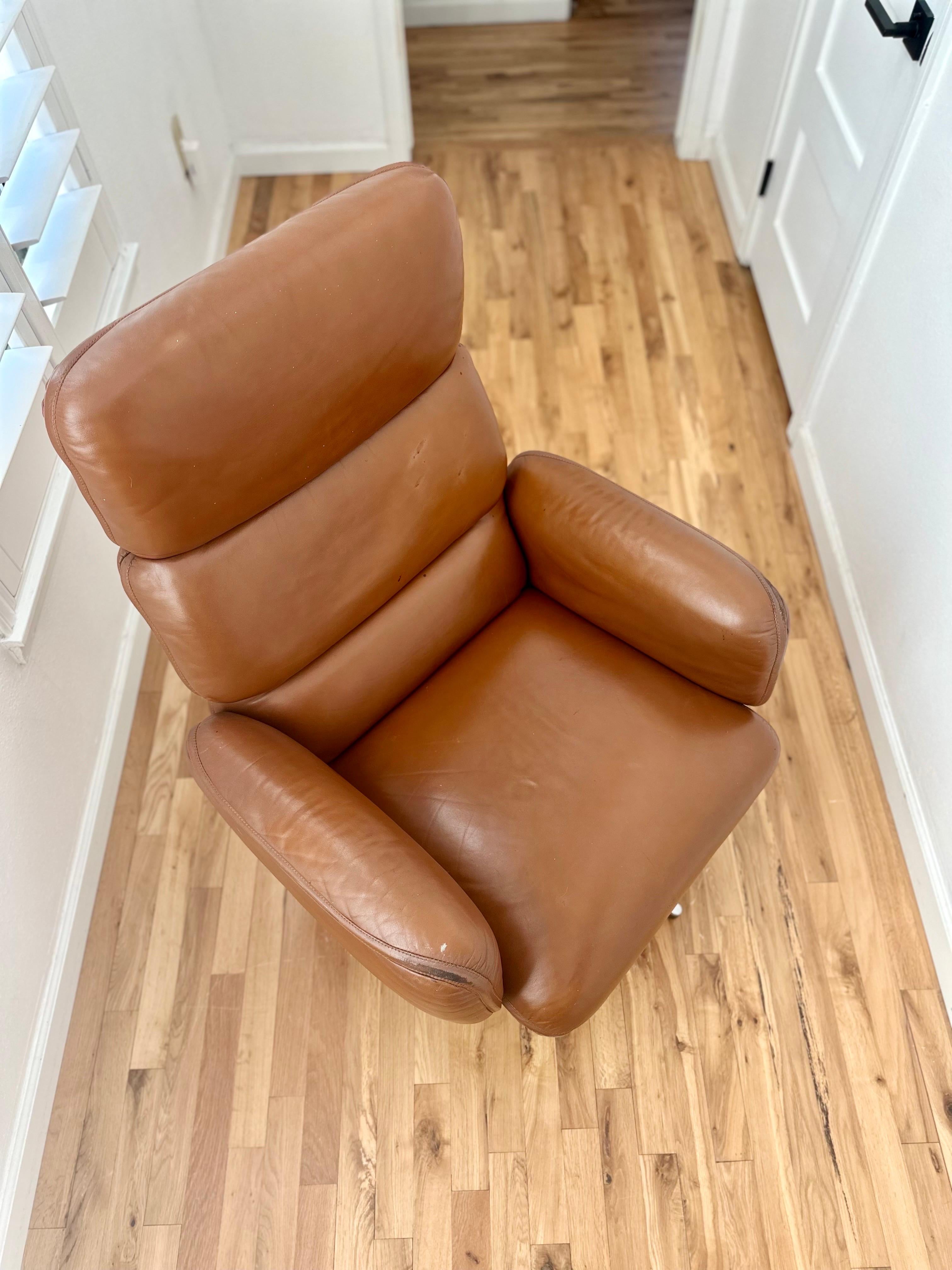 Handsome Otto Zapf for Knoll executive desk chair in cognac leather on four-star base with casters included. Soft, supple, and rich leather cushions are incredibly ergonomic yet the design remains timelessly modern. Swivels, tilts, and
