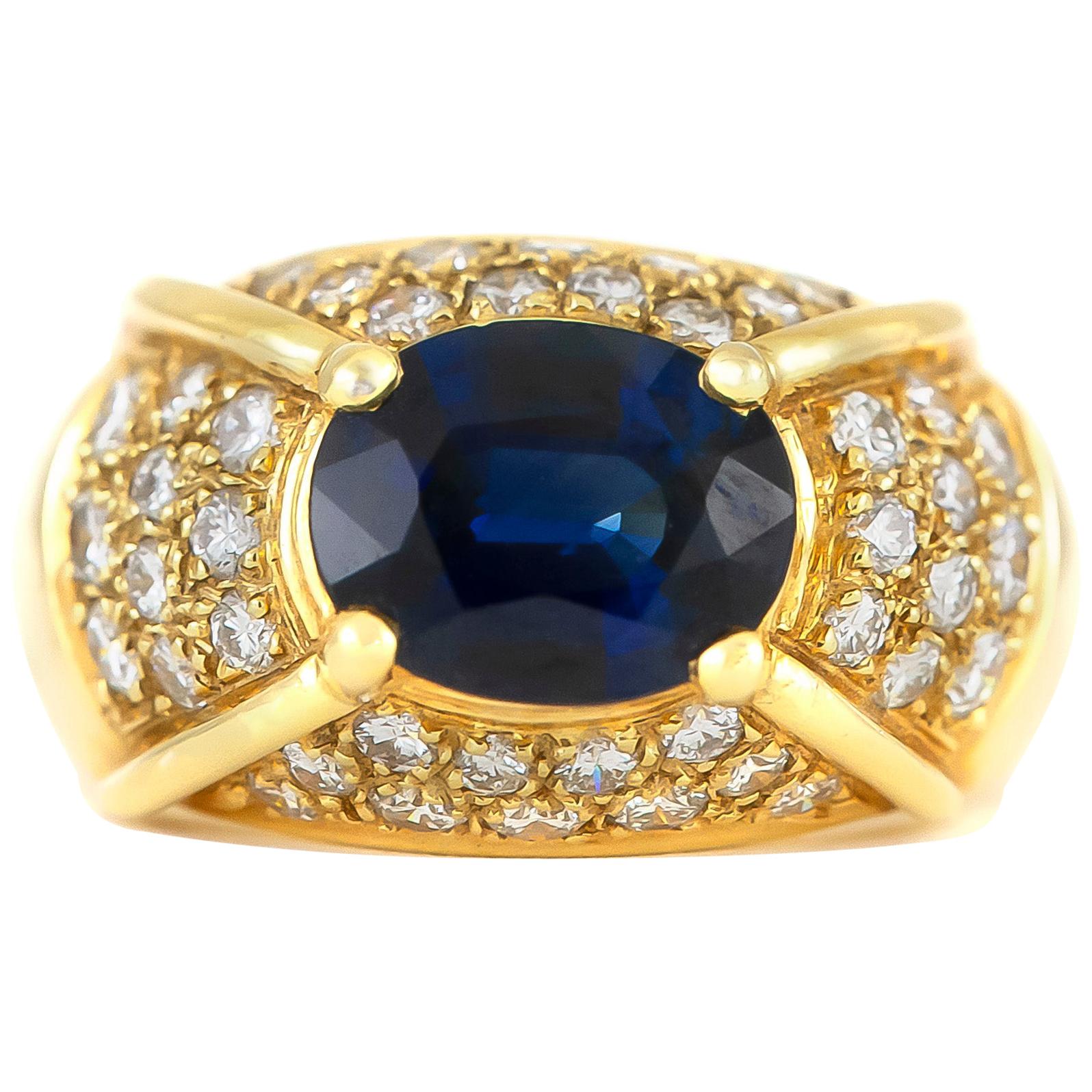 1970s Oval Sapphire with Diamonds on 14 Karat Yellow Gold Setting For Sale