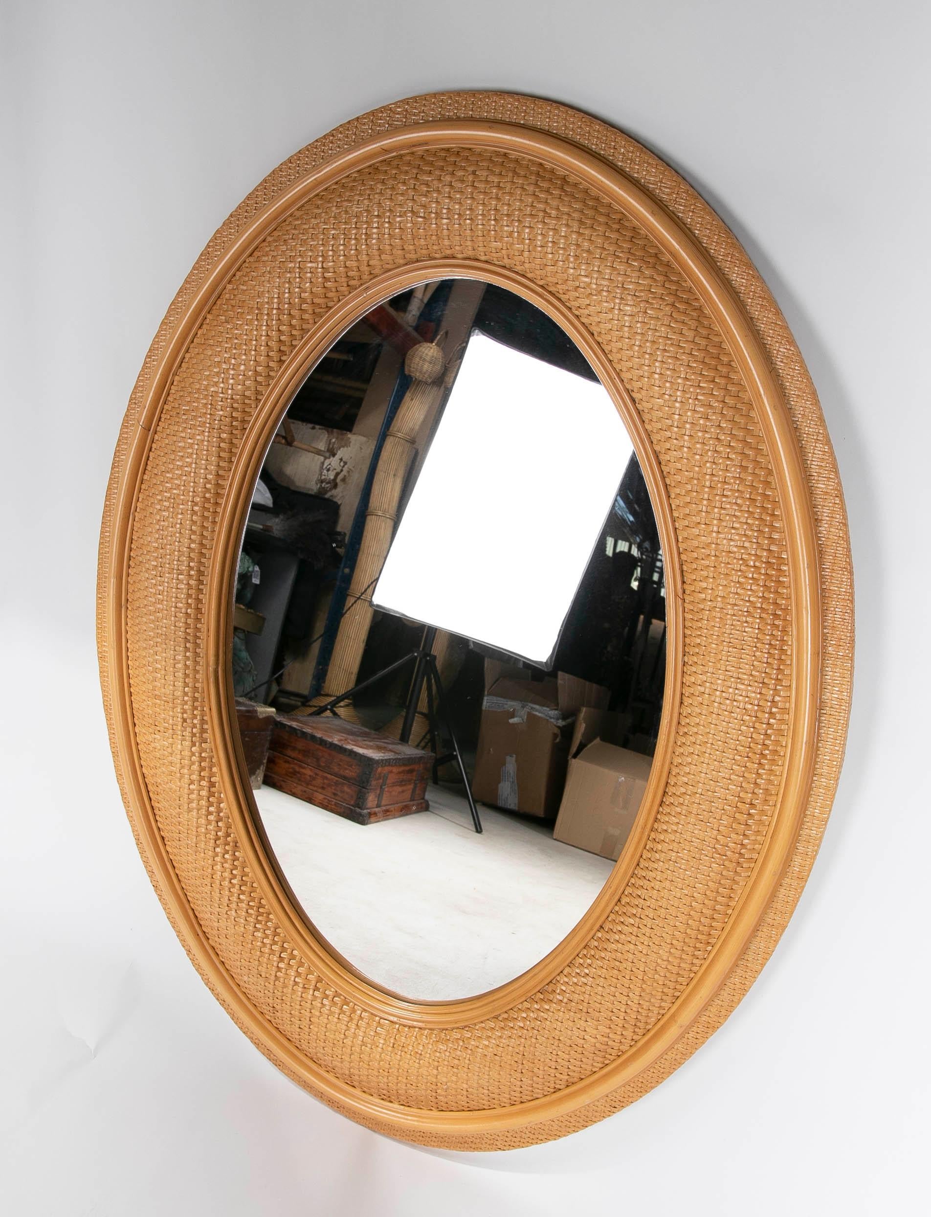 Spanish 1970s Oval Wicker Wall Mirror For Sale