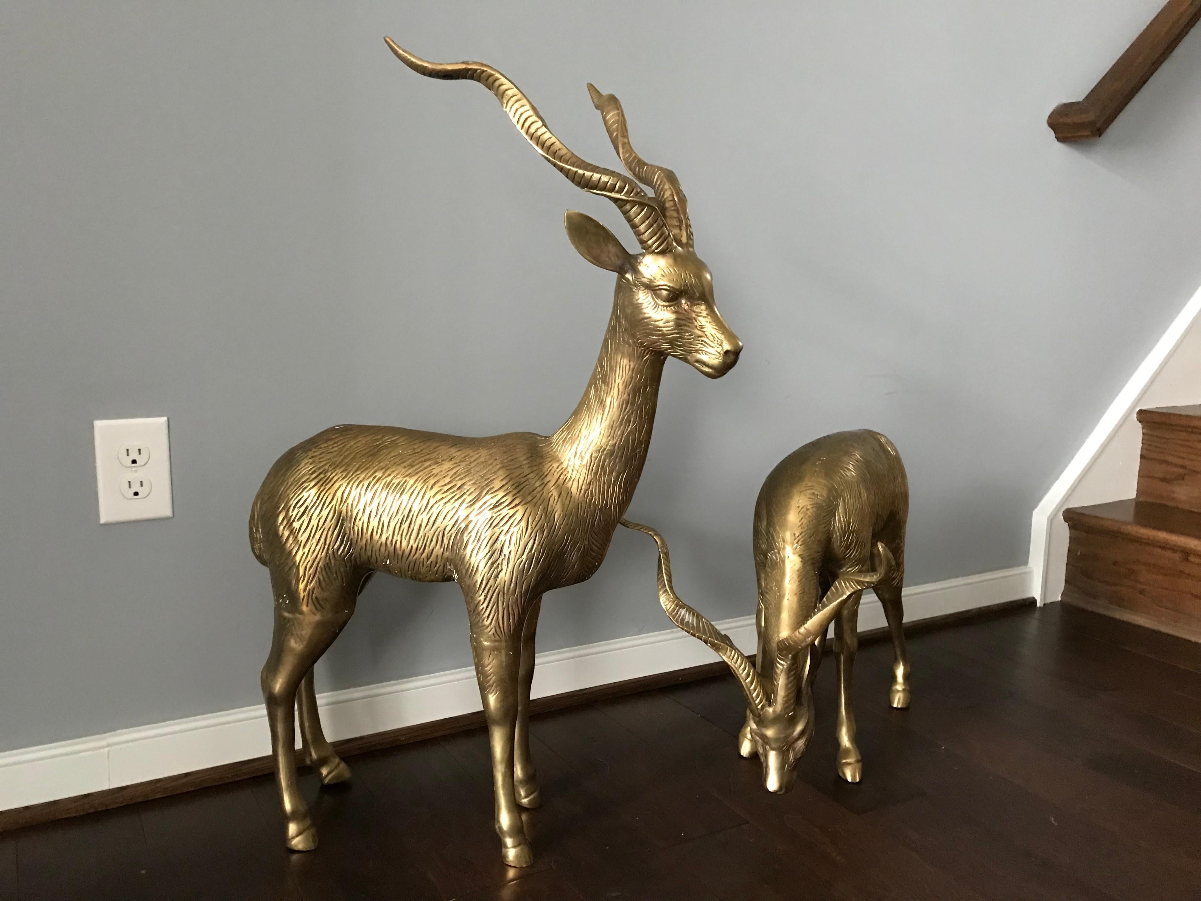Listed is a fabulous, pair of oversized, 1970s Italian brass gazelle sculptures. Lovely allover patina, can easily be polished by buyer. A great addition for any collector! Heavy, weighing nearly 45lbs for the pair. Small, 20lbs. Large,