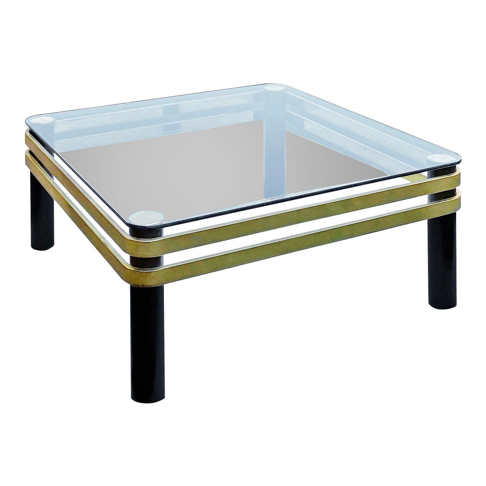 A beautiful 1970s brass banded and black lacquer tubular post coffee table with a glass top, by Pace Collection, with style attributed to Karl Springer. Beautiful, grand coffee table, in a hollywood regency and mid century modern style.