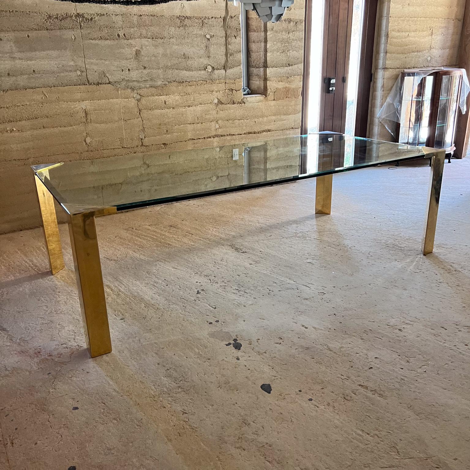 1970s Modern Elegance Long Brass Dining Table Base of Legs only
Brass plated legs. 
attribution Pace Collection.
Unmarked no label.
In the style of Romeo Rega and Mastercraft.
Stunning Regency era.
Original brass plated finish some areas are faded.