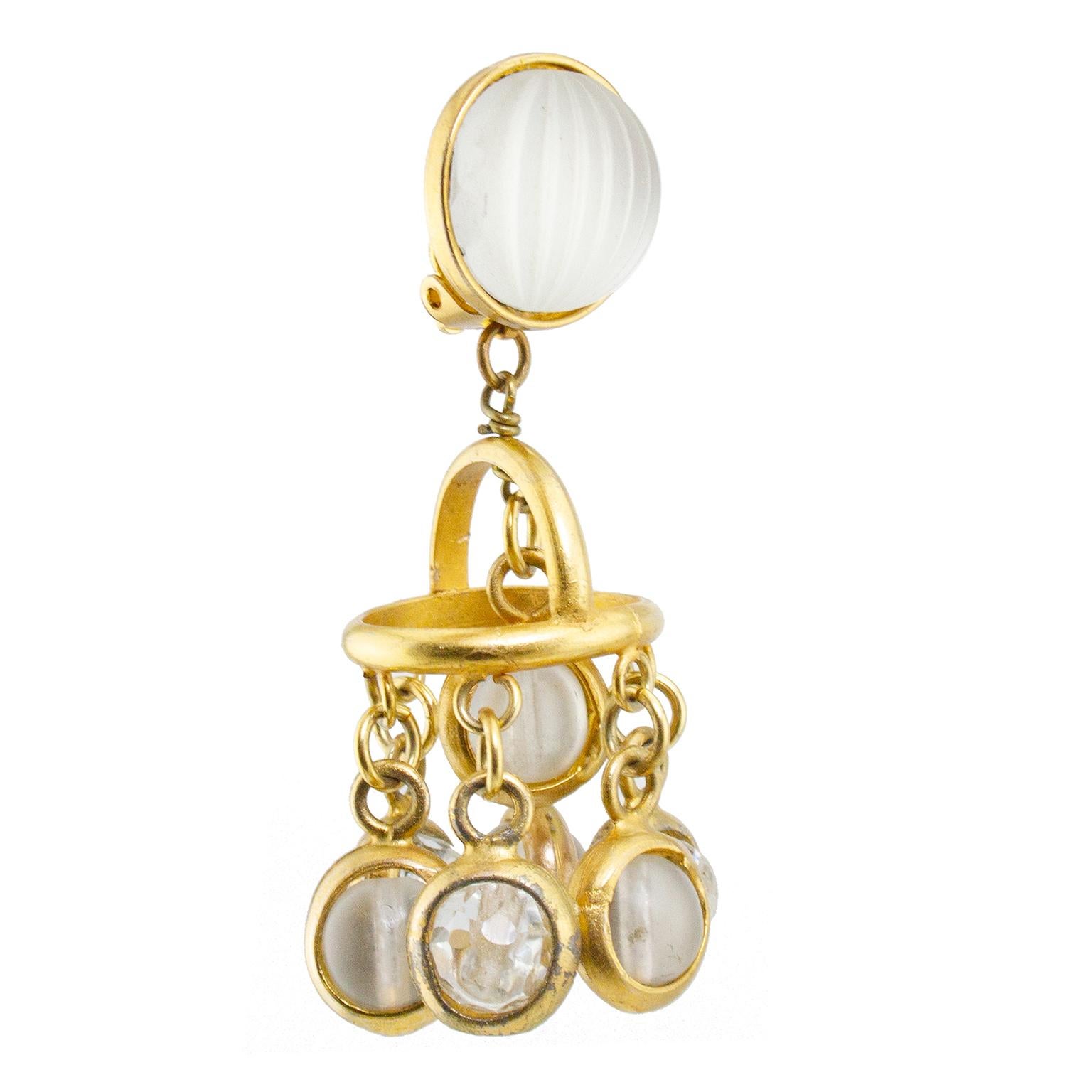 Rare 1970's Paco Rabanne clip on earrings. Gold tone metal with ribbed frosted glass button at top. The earrings drop down into a mobile-like pendant featuring dropped small chain links with clear crystal and pearl sphere stones. Back features clips