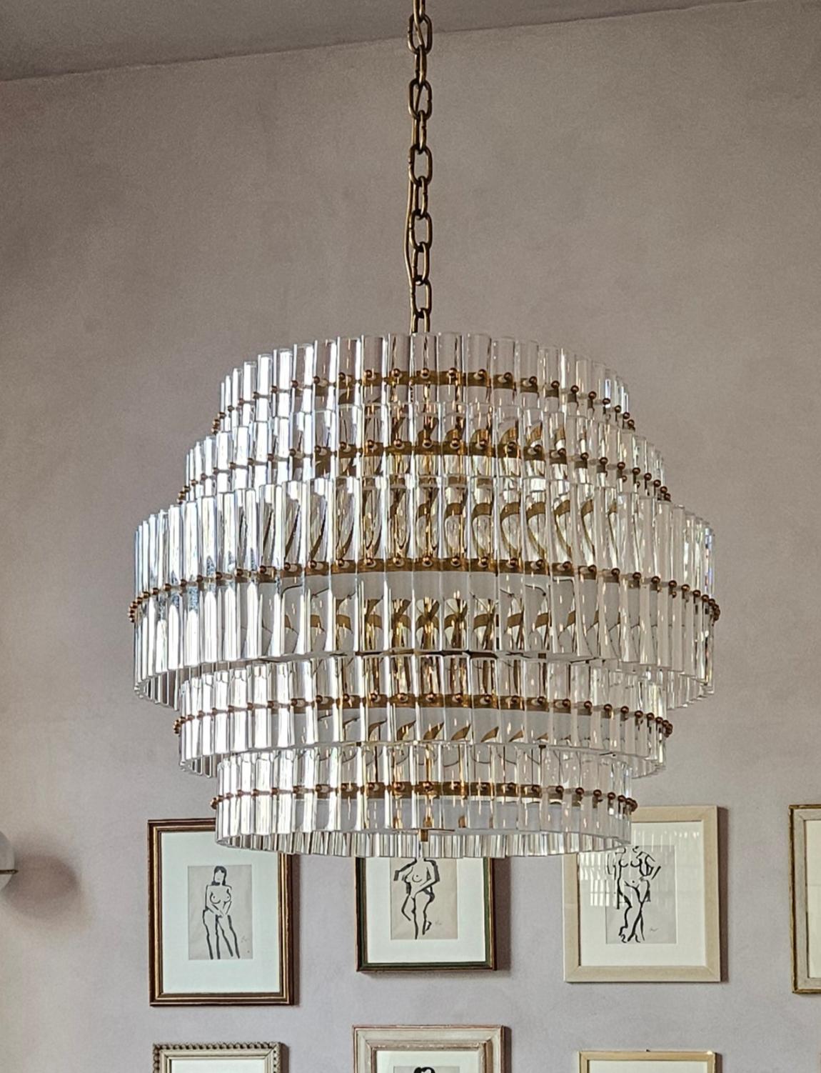 An extraordinary Murano glass chandelier originally made for a restaurant in Padua (Padova) in the 1970s. It is made up of over 400 individual Murano glass rods each individually screwed in place with a brass bolt. It weighs circa 100 kilos. The
