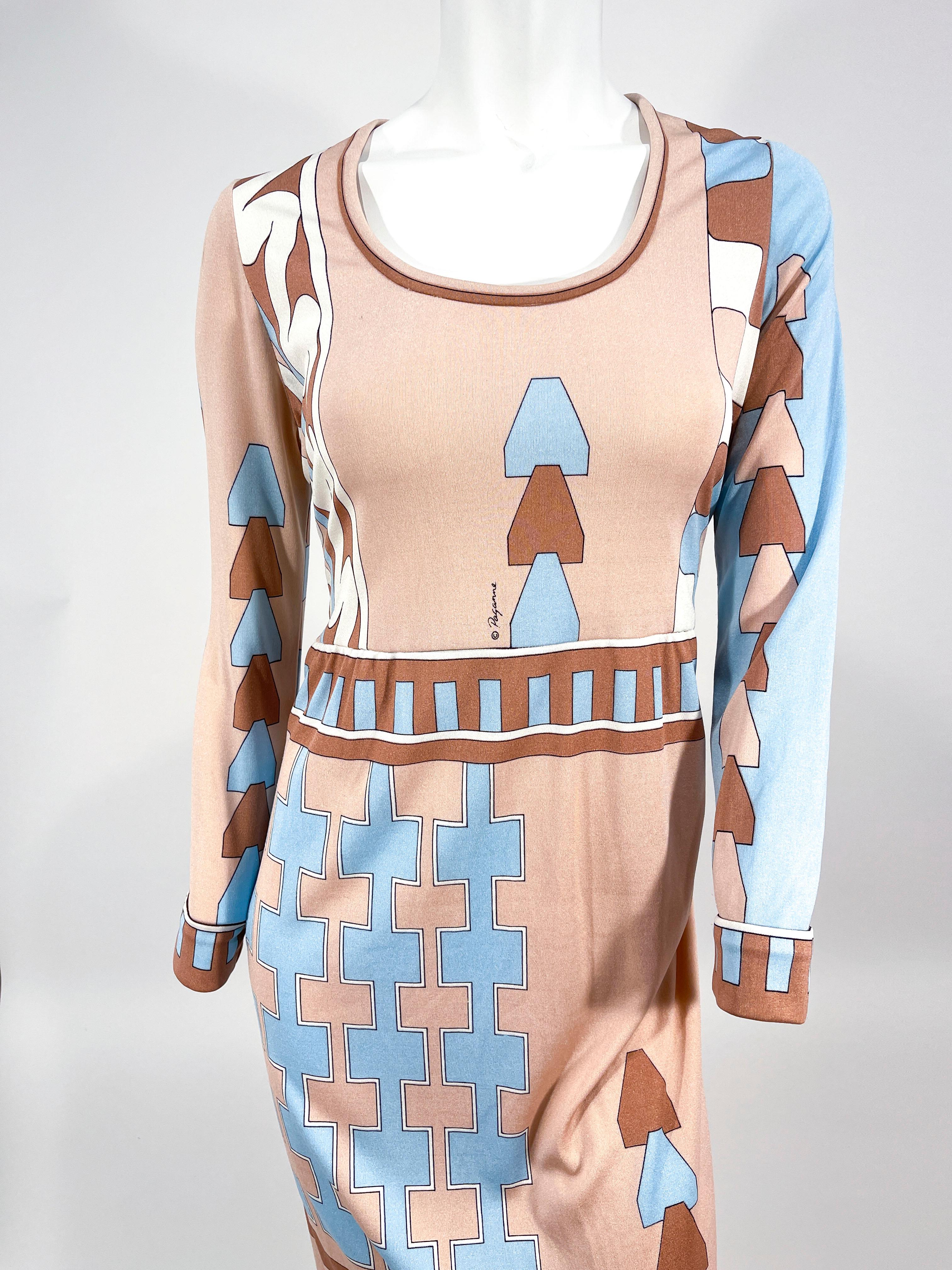 1970s Paganne silk jersey dress featuring an abstract geometric print in tones of mauve, tan, and light blue. There is a boarder print along the sleeves, bateau neckline, hem, and waist. This garment is unlined and has a zip back closure. 