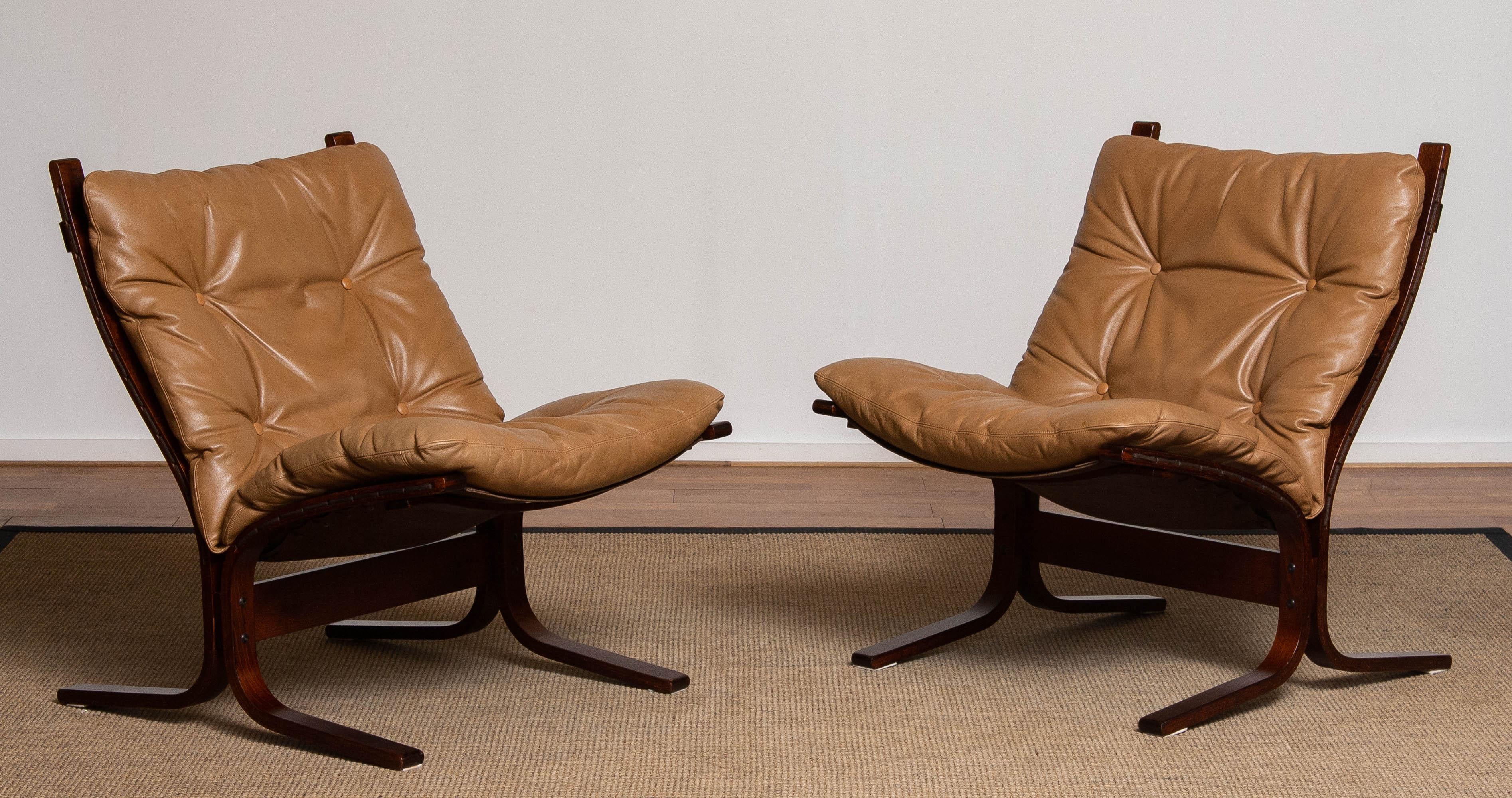 Perfect set of two 1970's camel leather lounge chairs, model 'Siësta', designed by Ingmar Relling for Westnofa Norway.
Allover in perfect condition.