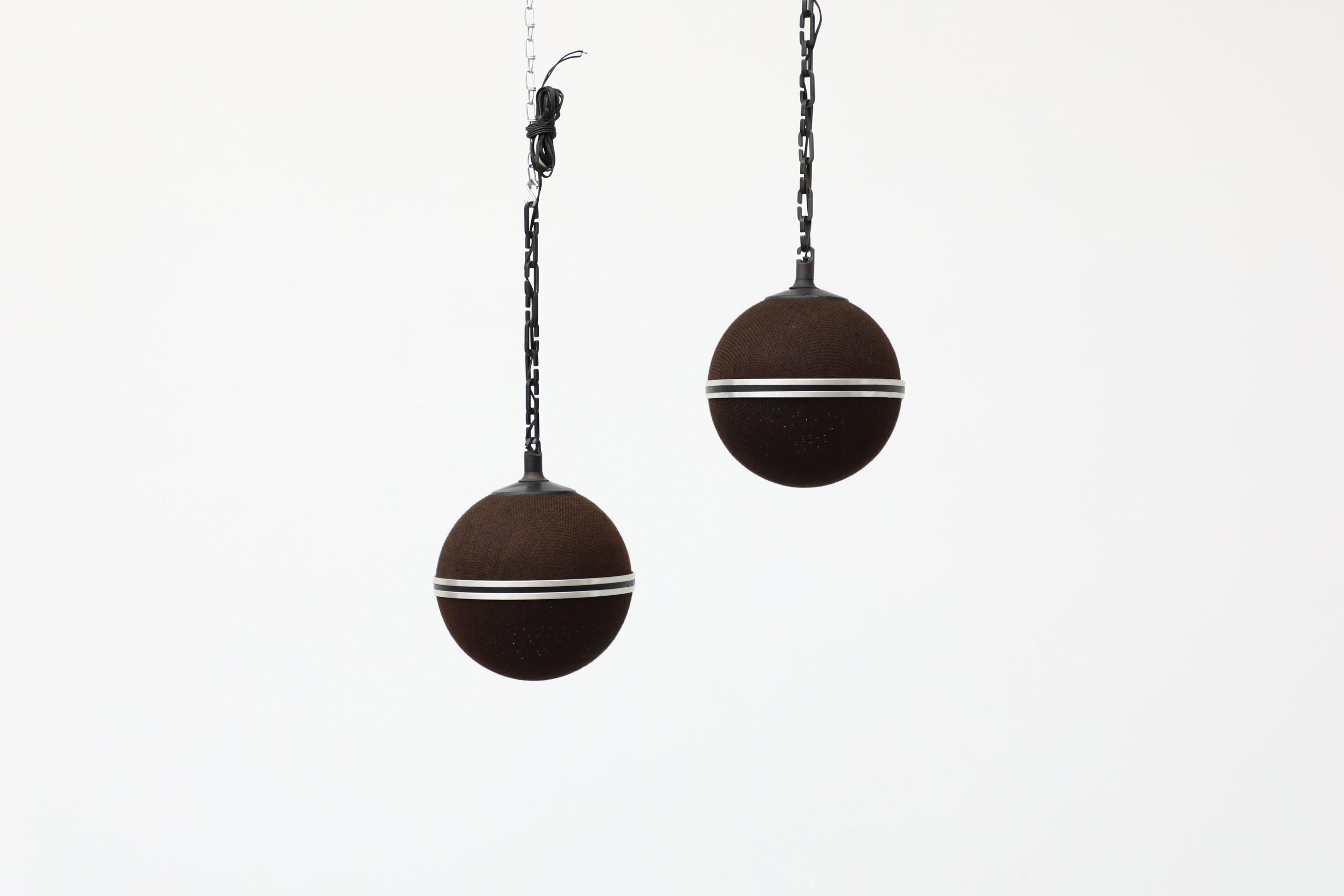Two Stolle attributed suspended globe speakers from the late 1970's. The eye catching pieces of European audio history come with hanging chains and are covered in the original brown fabric. In original condition with some age appropriate wear.