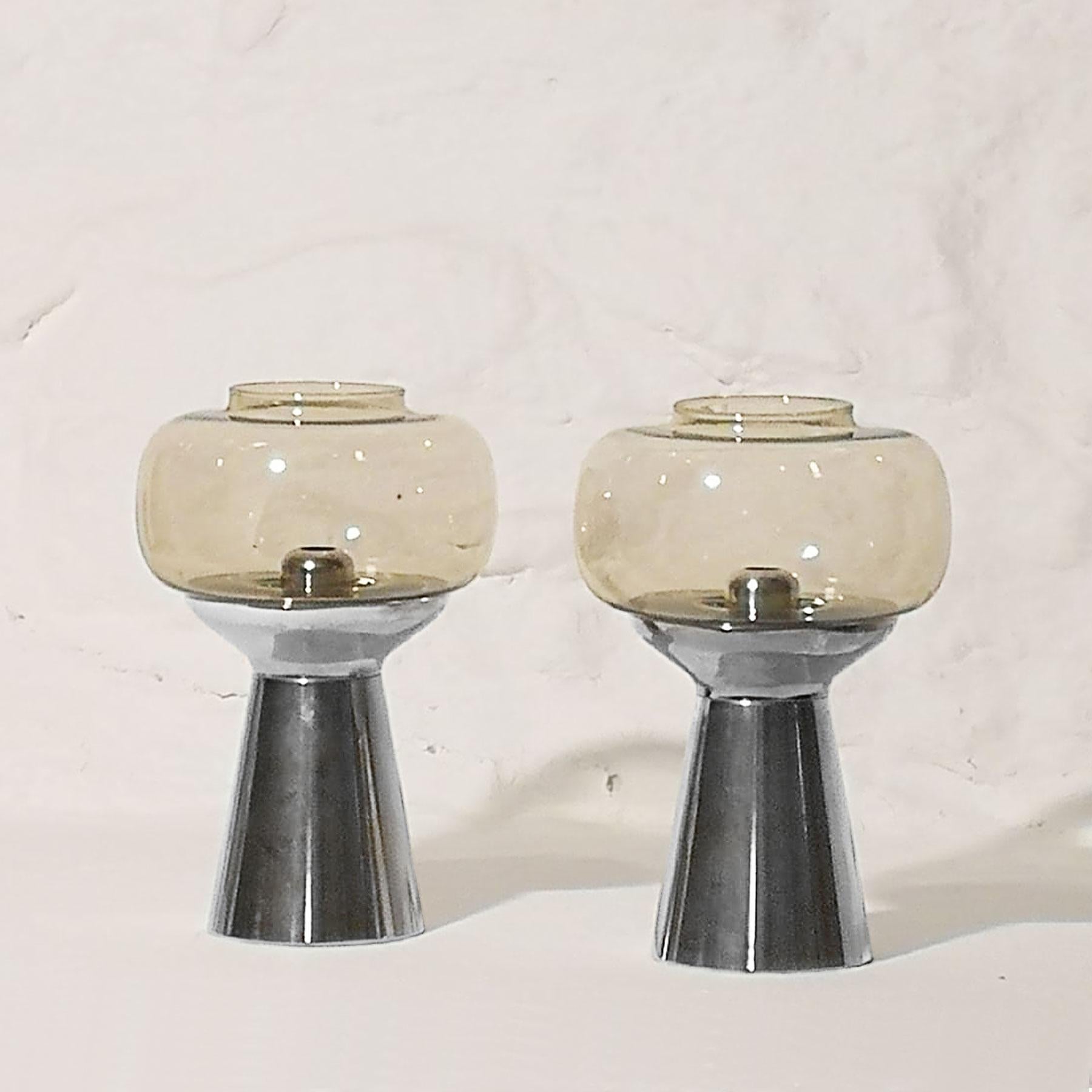 Pair of candleholders, chrome-plated metal and light smoked glass. Spring system for keeping candles at the right height.

Signed: FÖHL

Western Germany, circa 1970.