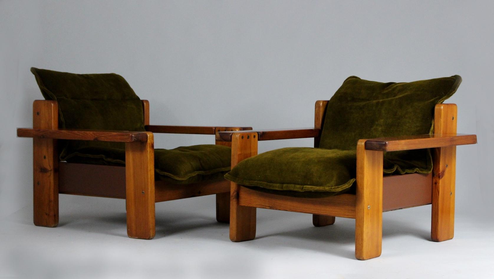 Pair of club chairs from the 1970s. Base is made from wood, green upholstery. Chairs are in very good original condition.