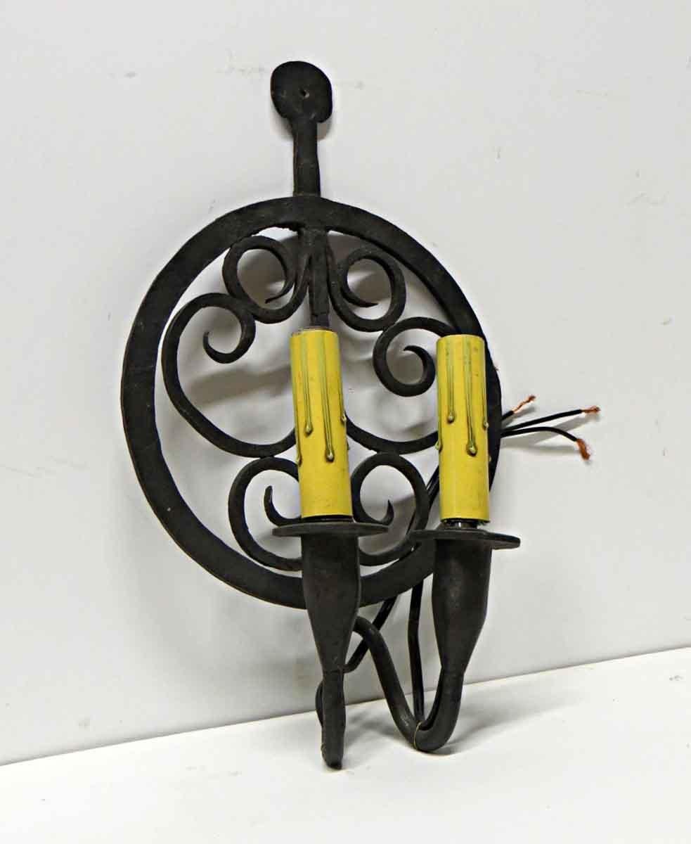 1970s Pair of Colonial Double Arm Wrought Iron Candlestick Sconces In Good Condition In New York, NY
