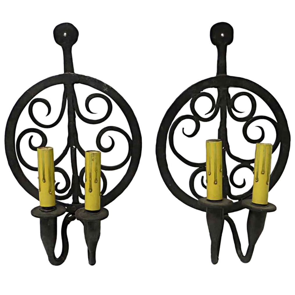 1970s Pair of Colonial Double Arm Wrought Iron Candlestick Sconces