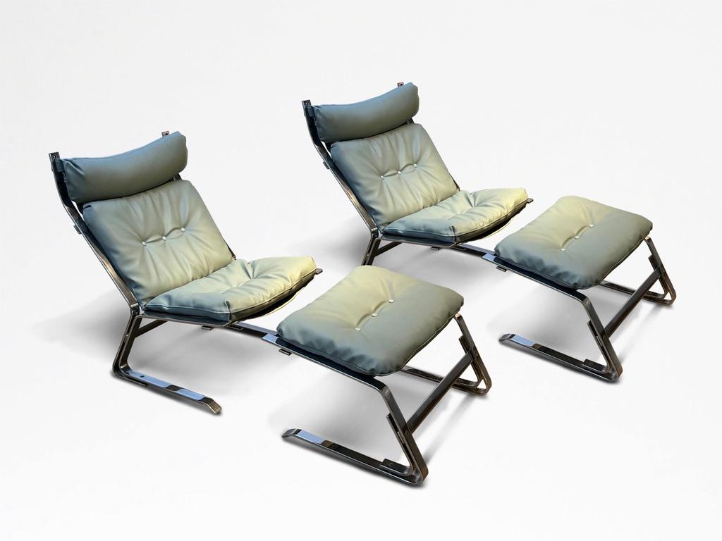 Attributed to Elsa and Nordahl Solheim, for Rykkn, Norway.

An extremely comfortable pair of easy chairs with companion footstools, chromed metal supports, the cushions re-upholstered in sage green leather, and sage green canvas supports. 

Each