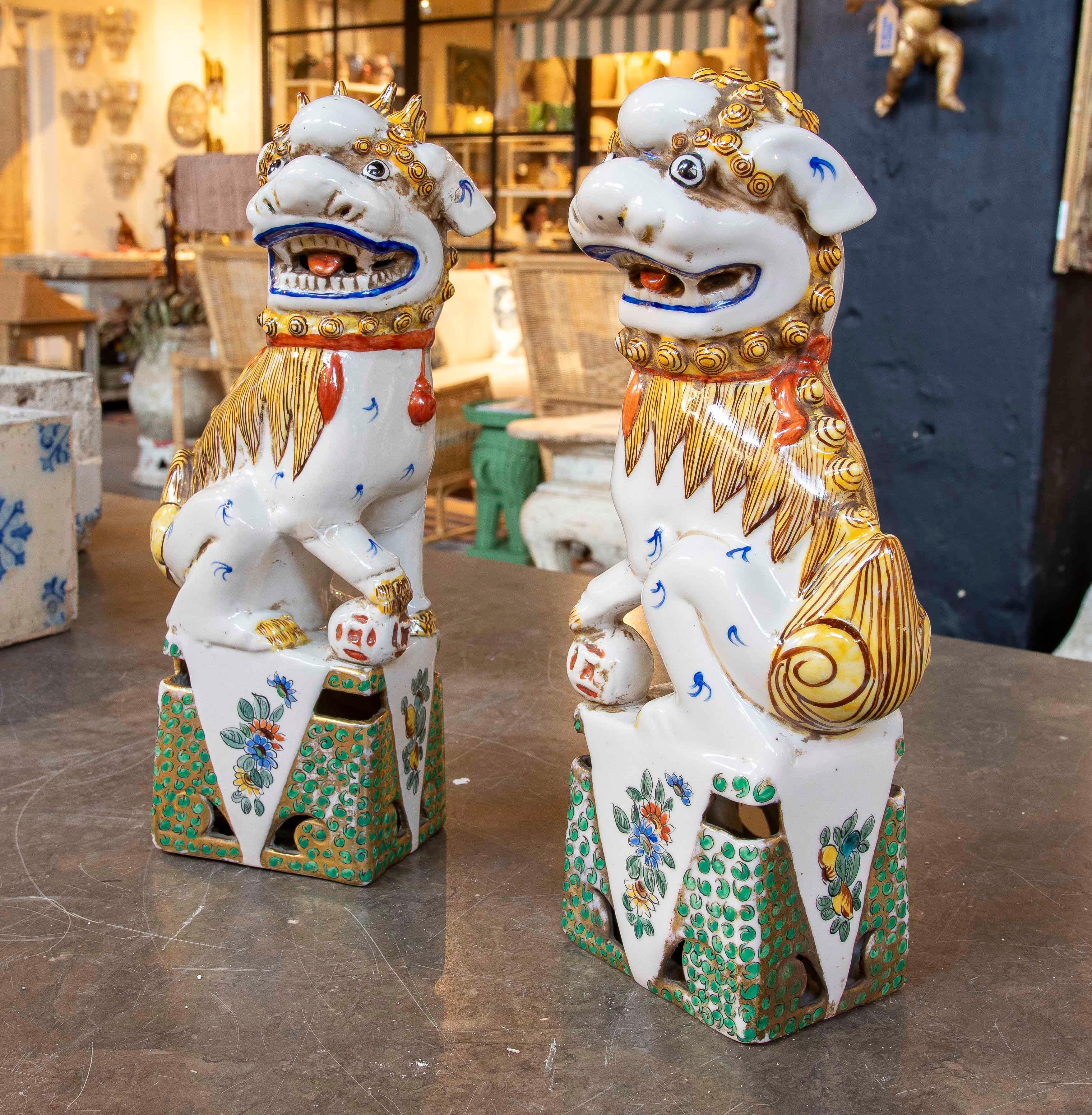Asian 1970s Pair of Enameled Porcelain Foo Dogs