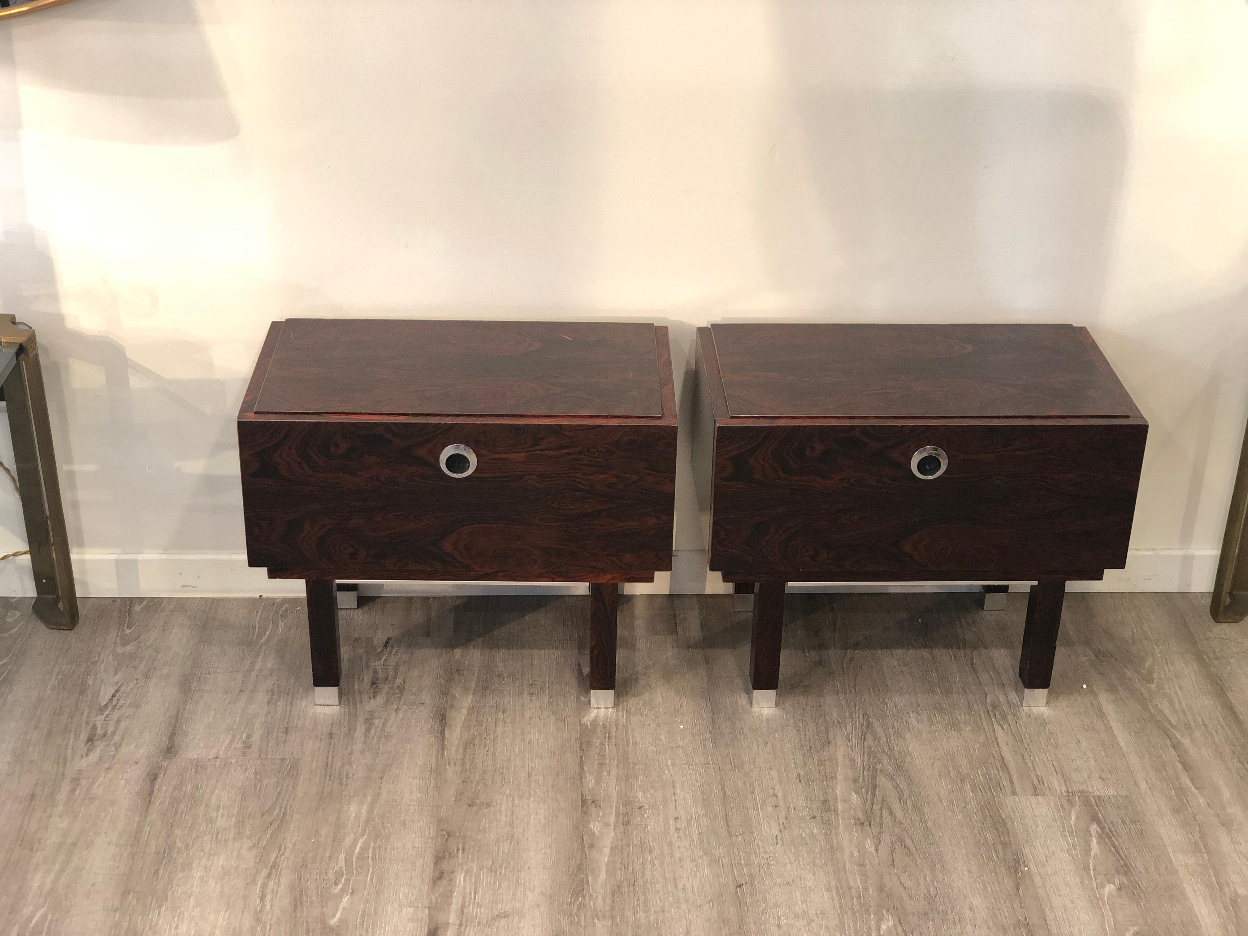 Flap door 1970s two nightstands from France, made of veneered rosewood they feature metallic details like the handles legs endings.
Good conditions, the bed side tables show wears coherent with age and use. Restored in conservative way.
Size: 44.5