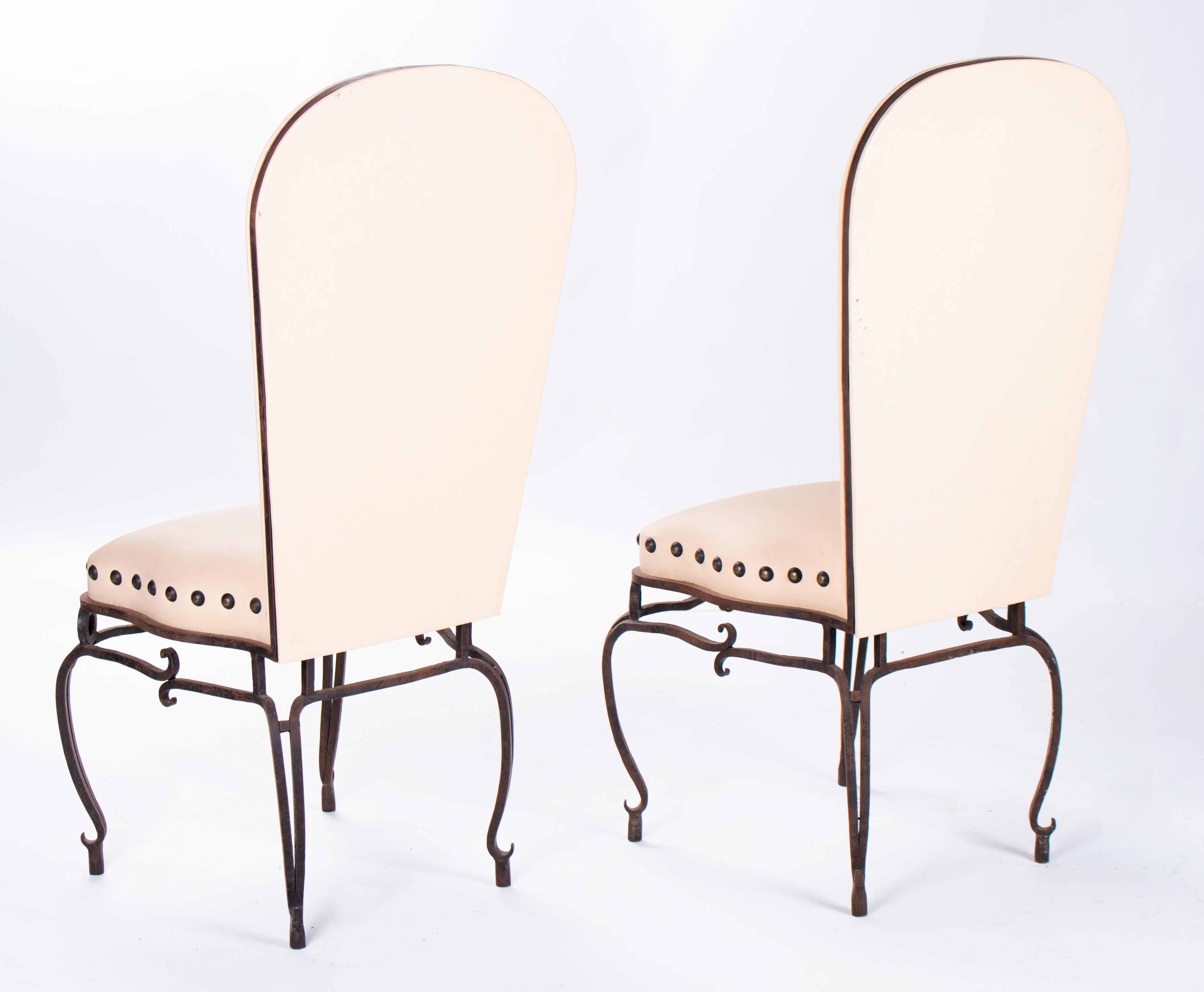 1970s pair of French wrought iron white upholstered chairs.