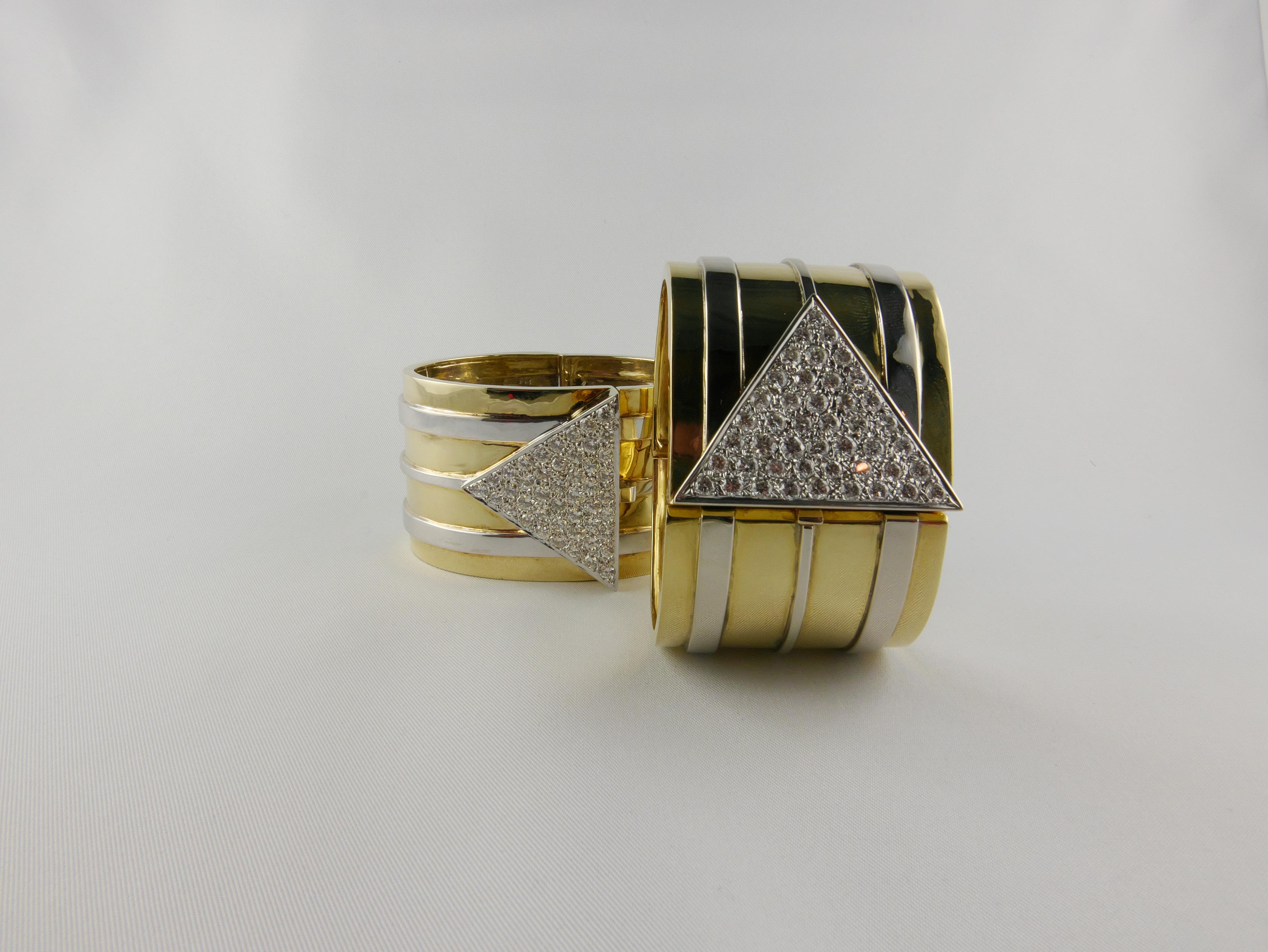 Important and imposing pair of Cuffs made up of patterns with convex lines in horizontally oriented striations
These wide 18k Yellow and White Gold 1970s Bracelets featuring a geometric design are accented with a 6 cts (each) sparkly pave diamond