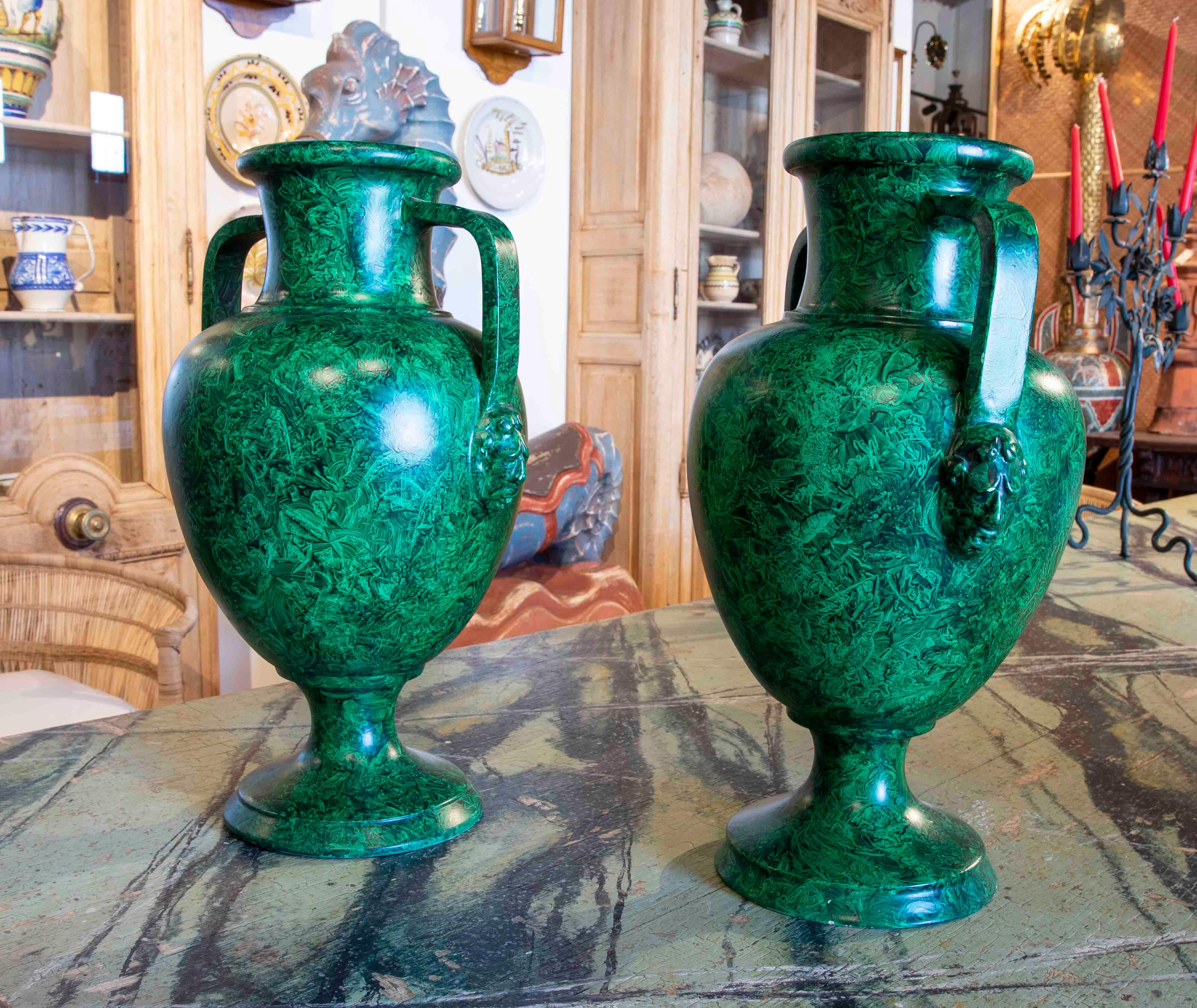 Pair of hand painted ceramic cups imitating malachite 1970s, with handles and heads of characters on the sides.