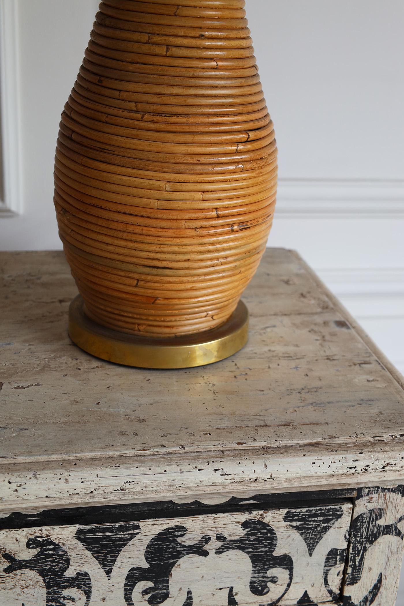 A pair of beautiful Italian rattan table lamps in the style of Gabriella Crespi, an Italian artist-designer whose work spanned furniture design, jewelry and sculpture. Circa 1970s
Made in rattan 