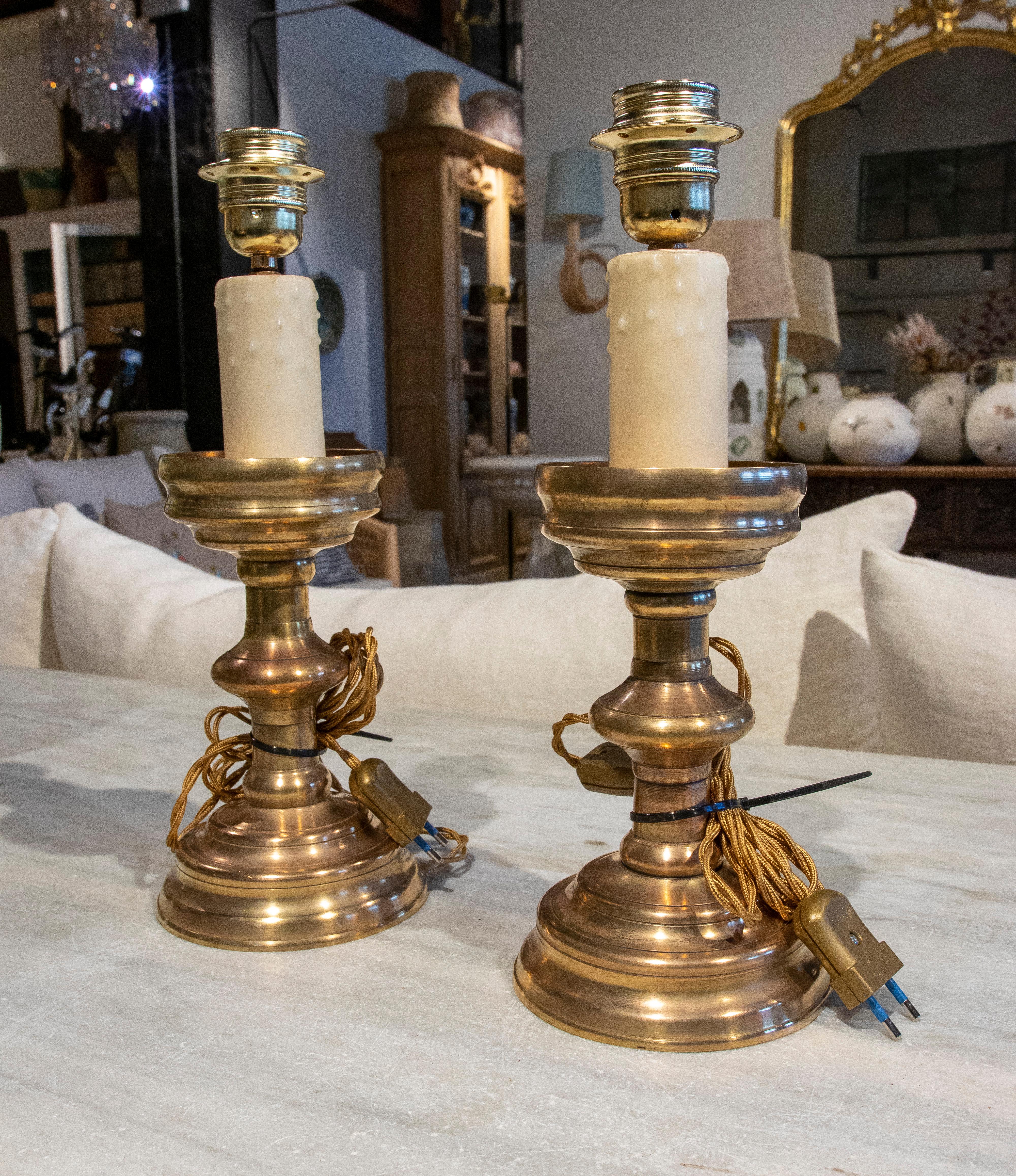 19th Century pair of lamps made with two bronze candlesticks.
