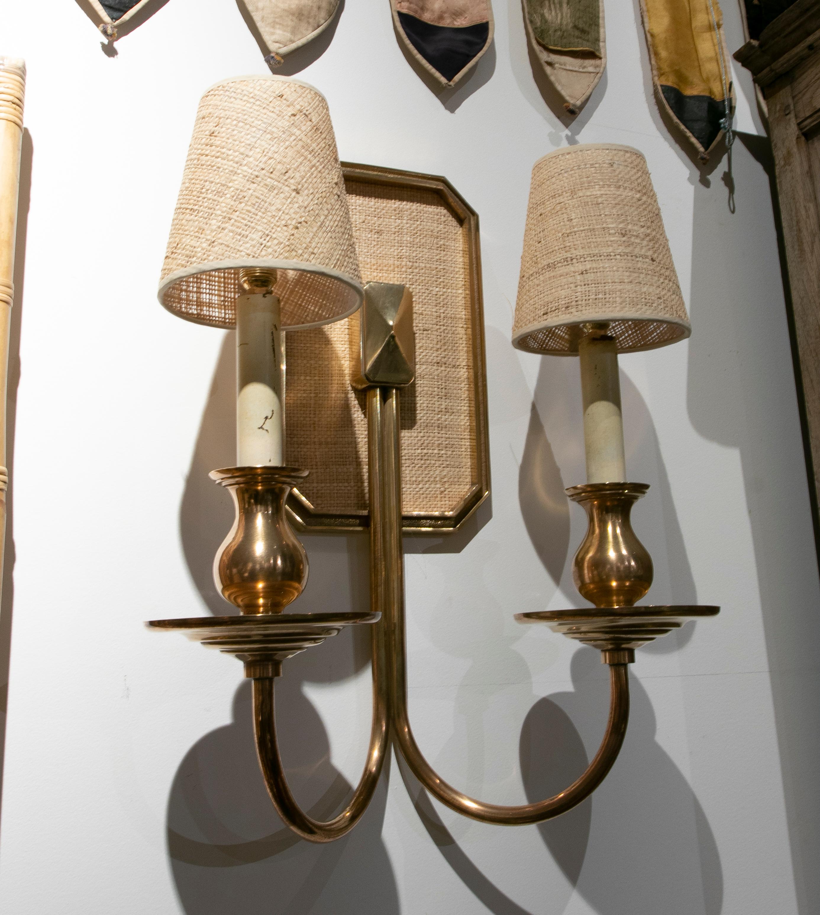 1970s Pair of lined bronze sconces with raffia lampshades.