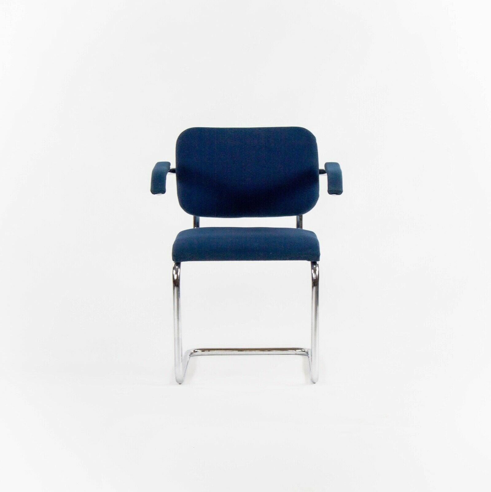 Listed for sale is a pair of 1970s vintage Cesca armchairs upholstered in blue fabric, produced by Knoll and designed by Marcel Breuer. The Cesca chair is an iconic Breuer design. These came from an estate near the Knoll factory in Pennsylvania. The