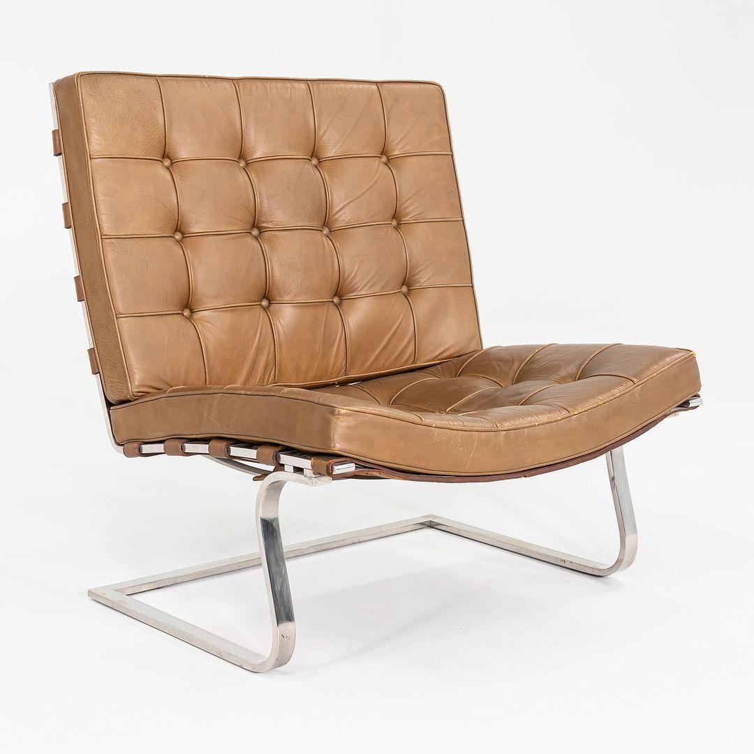 This is a pair of Tugendhat Armless Lounge Chairs, originally designed by Mies van der Rohe in 1929. These particular examples were produced by Knoll International in the 1970s, and the listed price includes the pair. 
 
 The leather upholstery is