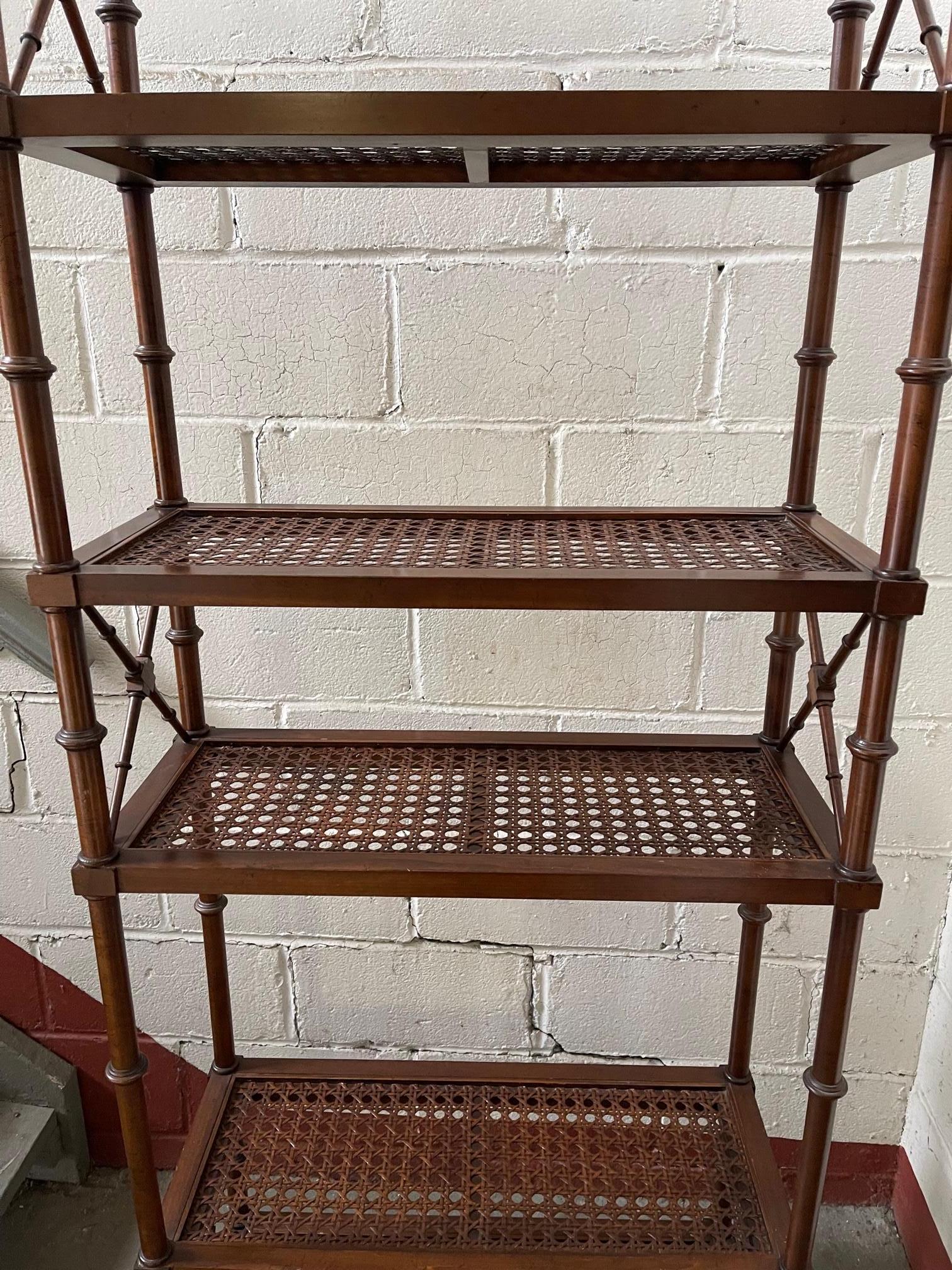 1970s Pair of Neoclassical Style Wood Etageres With Faux Bamboo Decoration and Caned shelves.  There are 5 shelves on each etagere and glass inserts that rest on the shelves