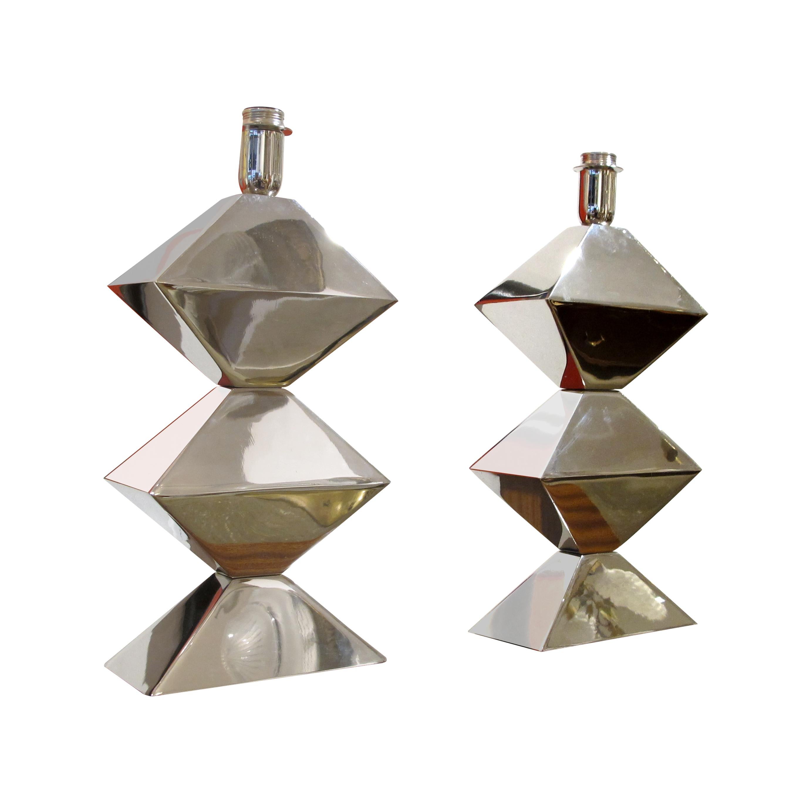 Pair of French geometric modern design table lamps. They are sleek and stylish, with a minimalist form and the lamps are nickel chrome-plated with a high shine. The chrome-plated surface gleams brilliantly, reflecting ambient light that elevates any