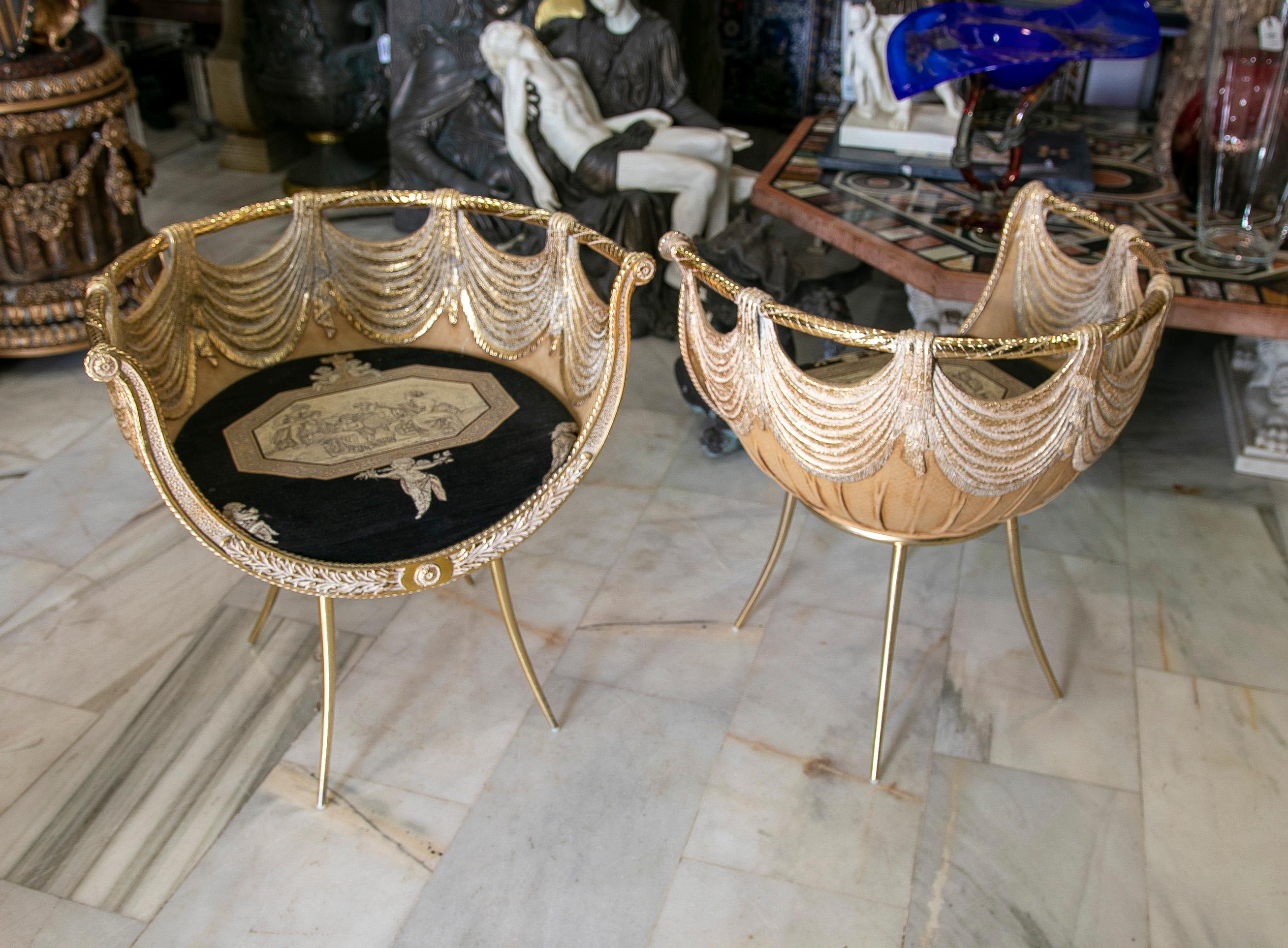 1970s pair of Resin and Gilded metal curtain Shape's armchairs.