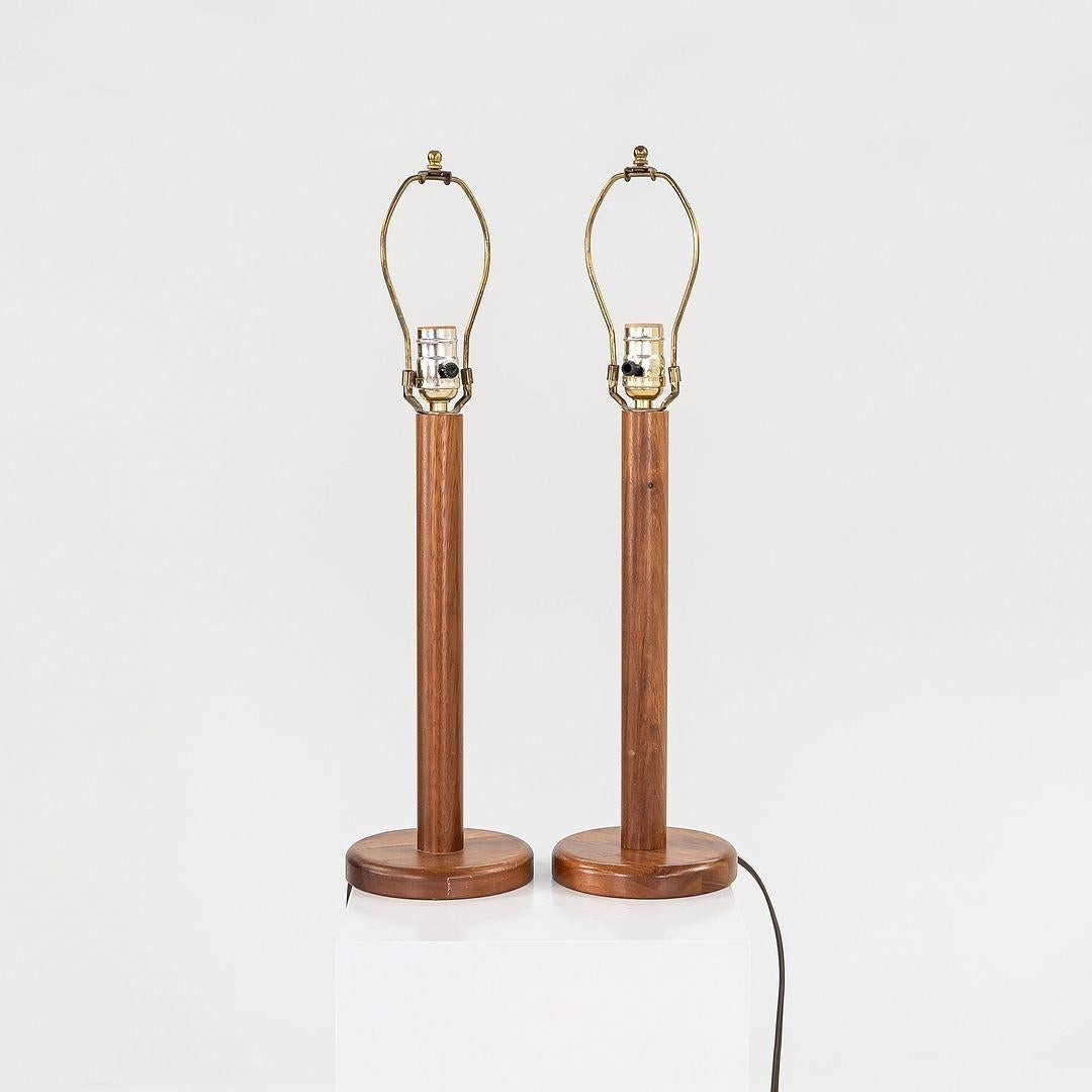 This is a pair of matching teak table lamps with off-white tapered shades, dating to the 1960s. They are Scandinavian in origin, though we are unsure of their maker. They have solid bodies of teak and retain their original writing.

The listed price
