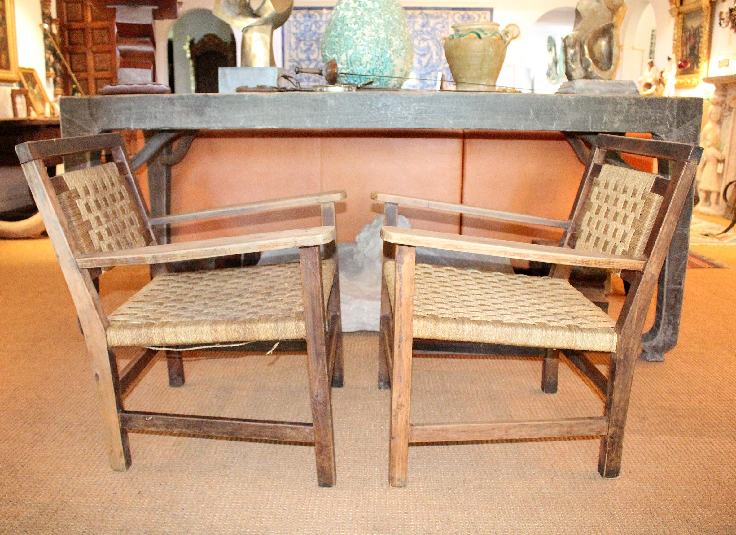 1970s pair of Spanish handmade laced wicker over a wooden structure armchairs.
 