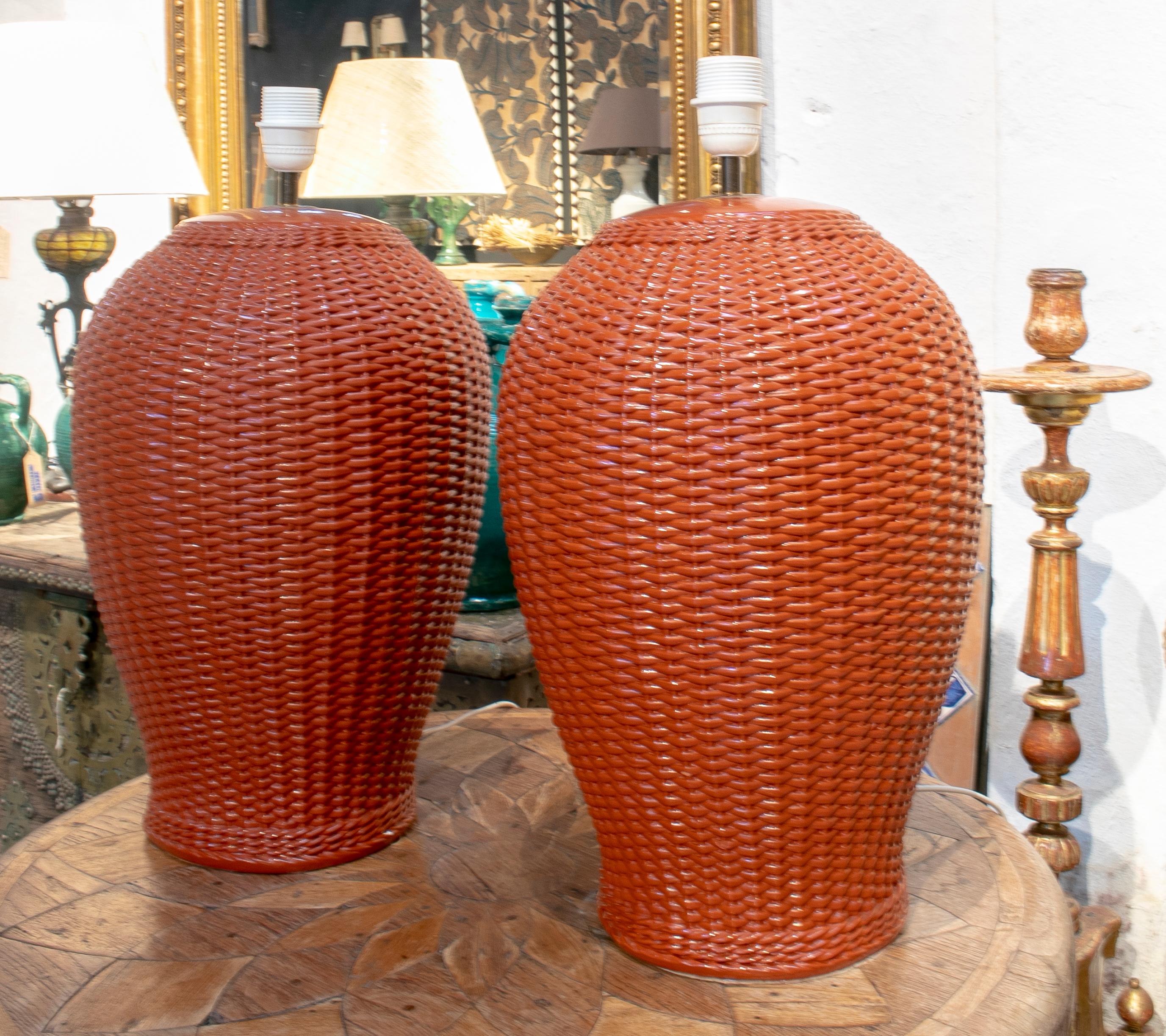 1970s pair of Spanish red ceramic table lamps imitating handwoven wicker.