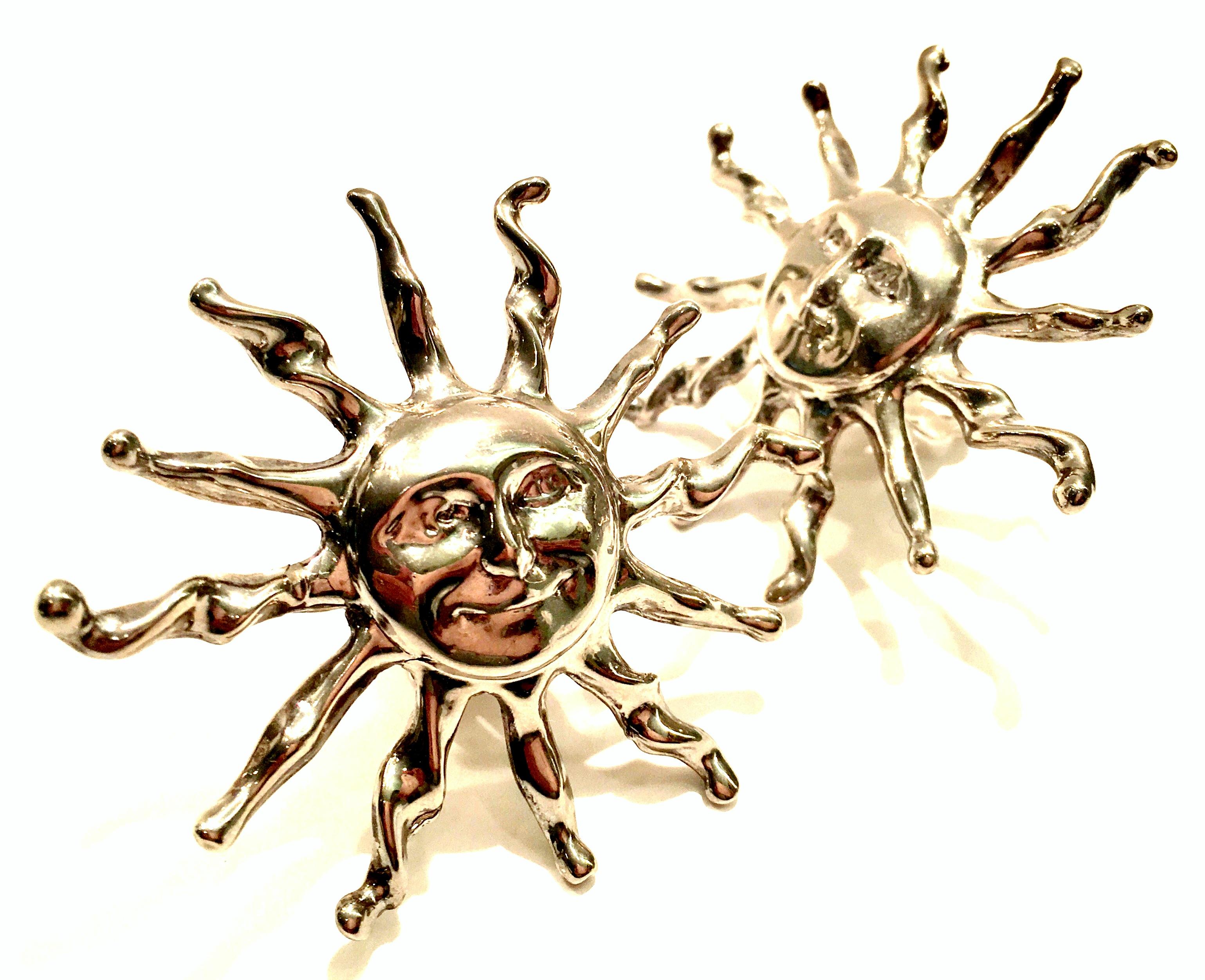 1970's Pair Of Sterling silver large abstract sunburst clip style earrings. Earrings, total weight, 34 grams and unmarked. Most likely from Mexico.