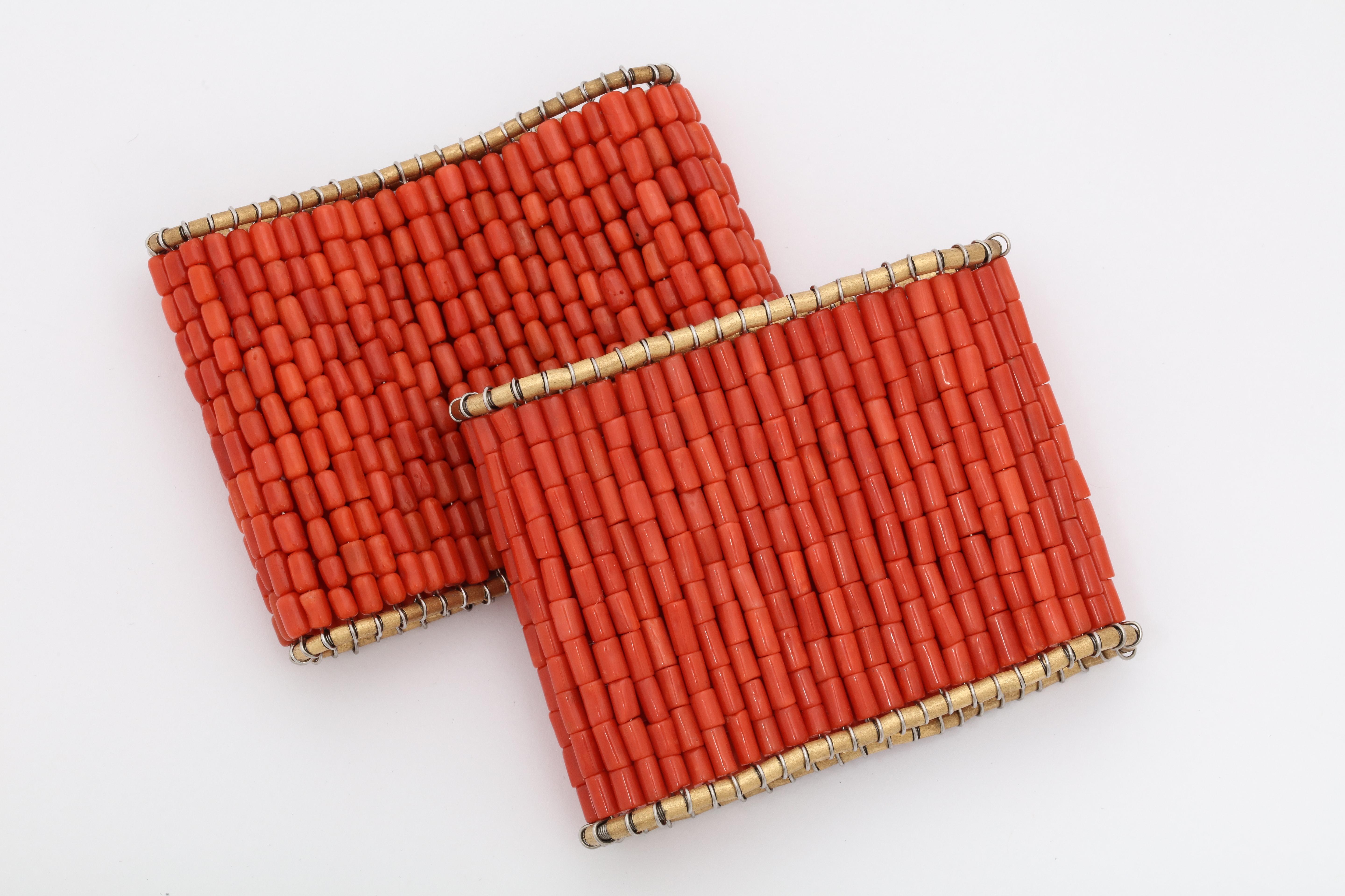 One  Ladies 18kt Gold One Size Fits All Slip On Cuff Bracelets Designed With Numerous Coral Rectangular Beads. Beautifully And Flexibly Made In A Giant Jumbo Dramatic Width. Circa 1970's.NOTE: May Be Sold Separetely.One Is Left For Sale  One Had