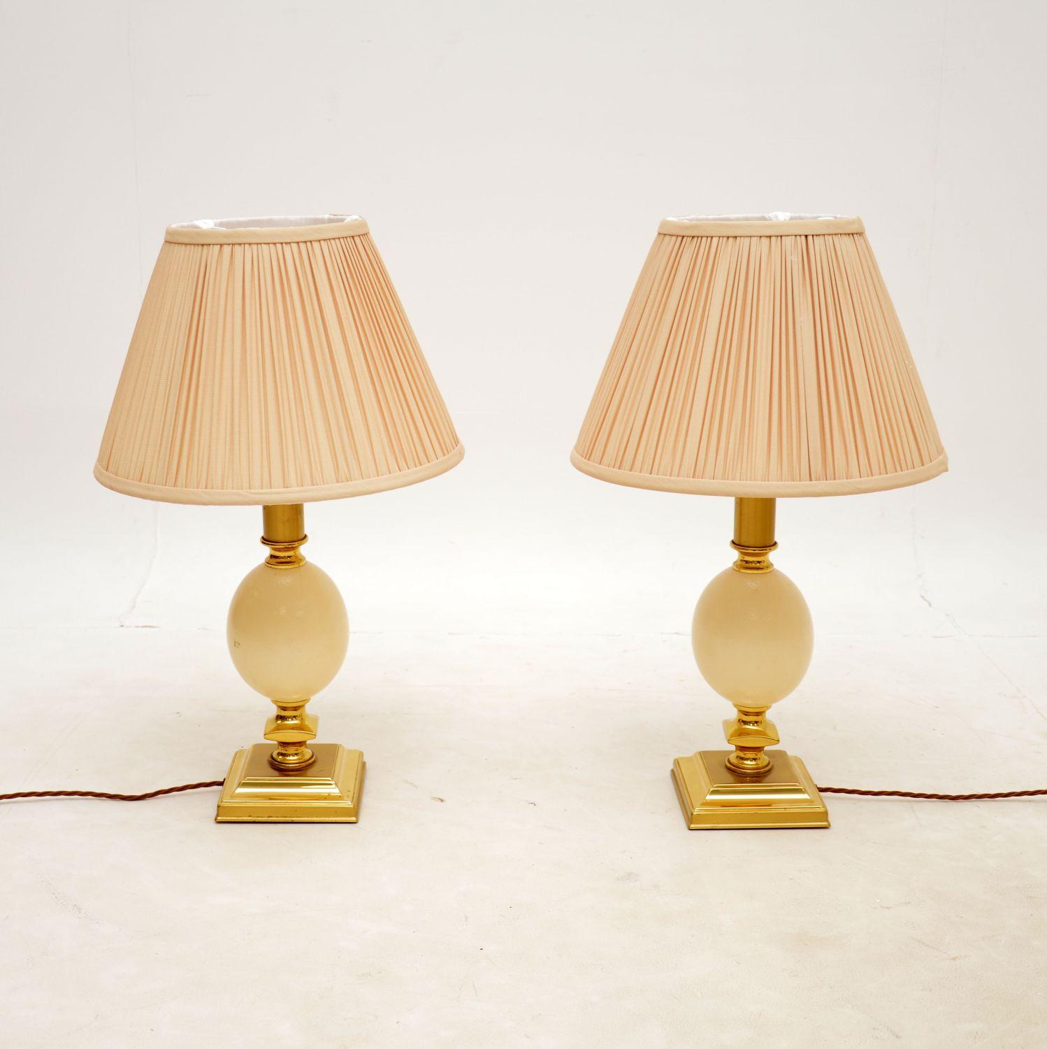 A stylish and unusual pair of vintage 1970’s brass ostrich egg lamps with faux ostrich egg bases.

The quality is excellent and they are a great size. The condition is excellent for their age, they are clean and free from damage. We have had these
