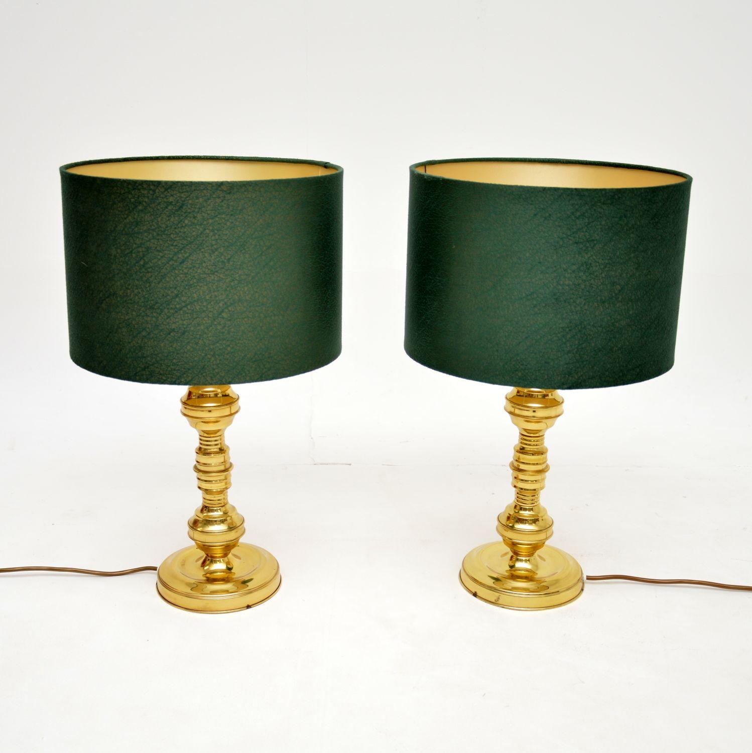 A very stylish pair of vintage table lamps in brass. They were made in England, and they date from the 1970’s.

The quality is excellent, these are a lovely size and have been paired with modern green velvet shades.

We have had these re-wired, they
