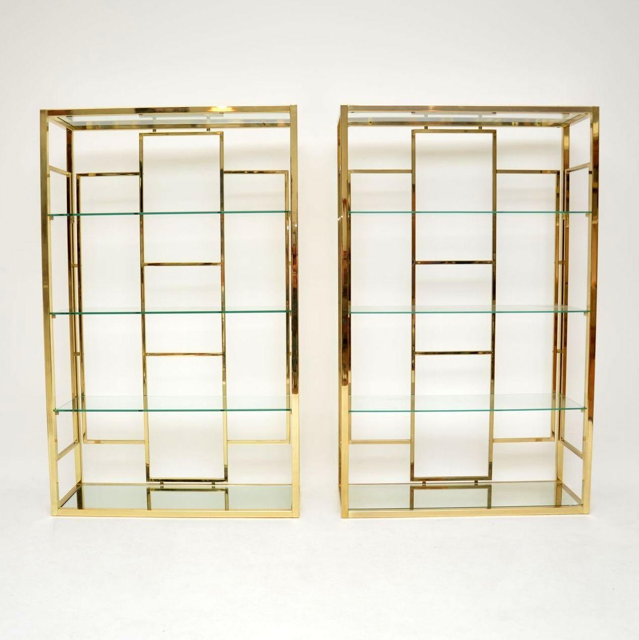 A beautiful and extremely well made pair of vintage brass display cabinets / bookcases, these were made in Italy during the 1970s. They are in superb condition for their age, the brass frames are clean, sturdy and sound, with only some extremely