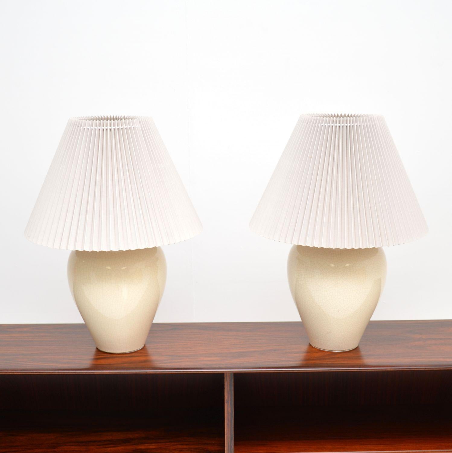 A stunning pair of vintage porcelain table lamps. They were made in England, and date from around the 1970-80’s.

The quality is fantastic, they have a wonderful shape and the cream porcelain has a wonderful crazed effect.

The condition is