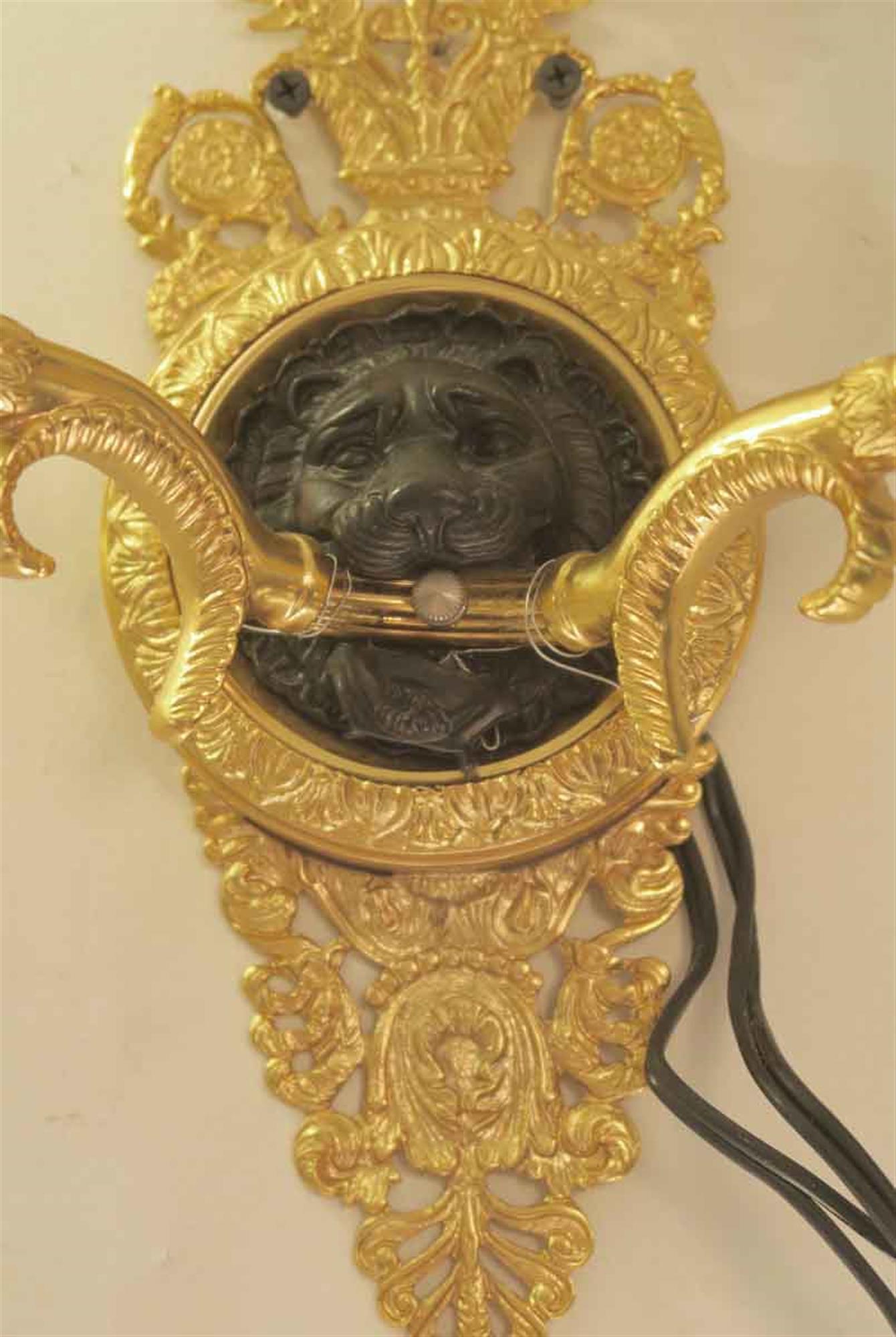 Pair of Waldorf Astoria Empire Gold Gilt and Black Lion Head Brass Sconces In Good Condition In New York, NY
