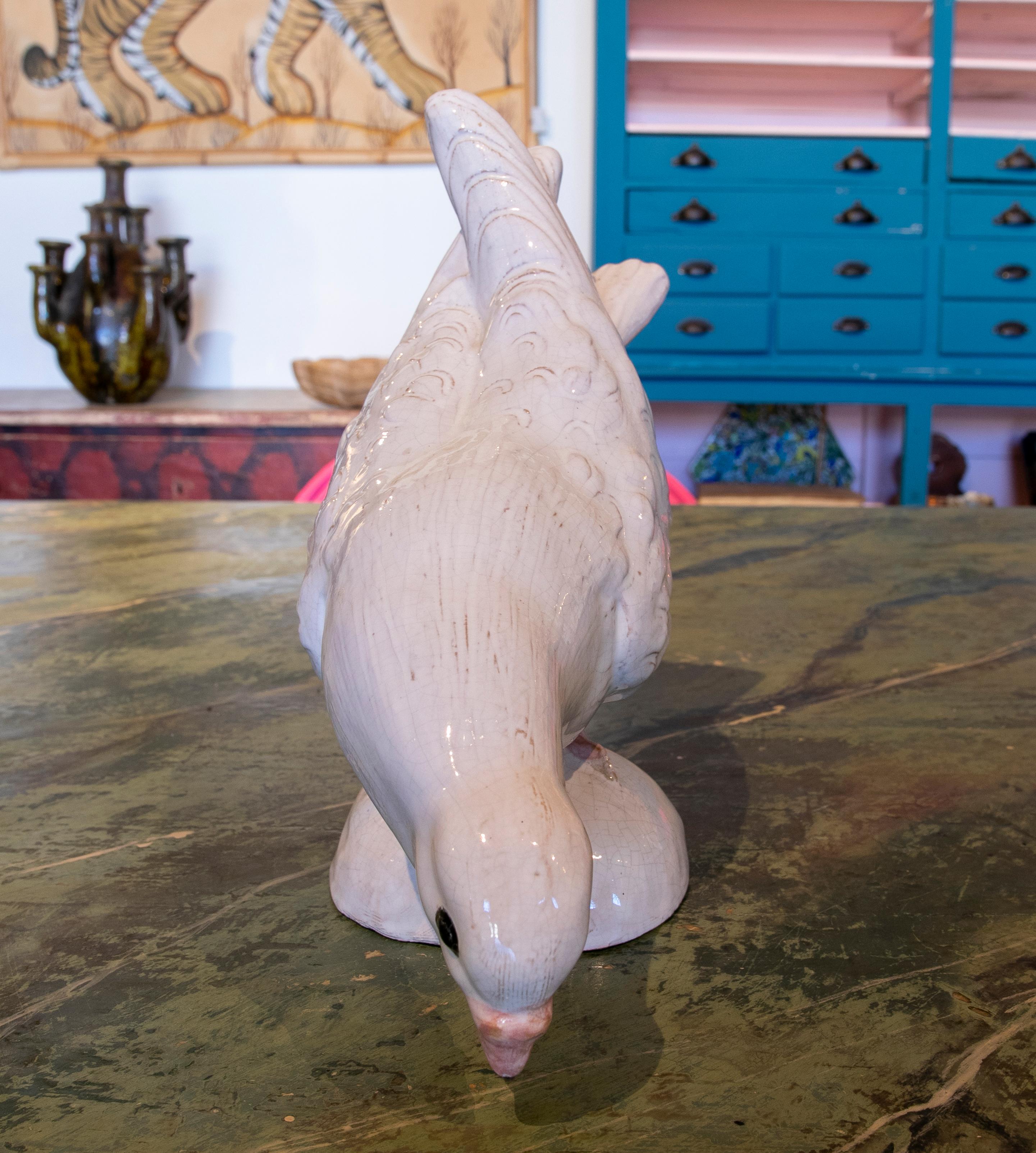 1970s pair of white glazed ceramic sculptures of pigeons.