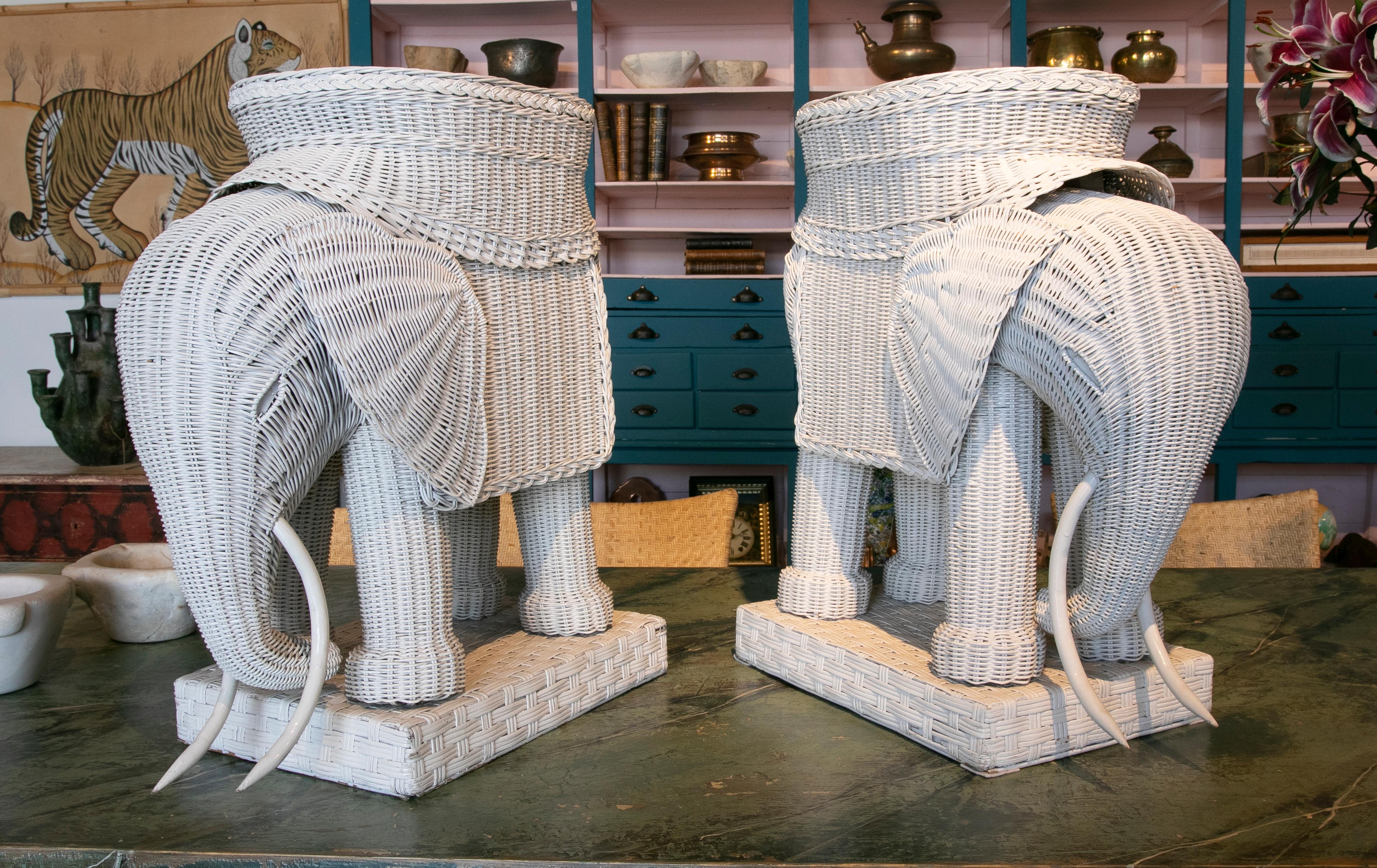 1970s pair of wicker tables in the shape of elephants and painted in white.