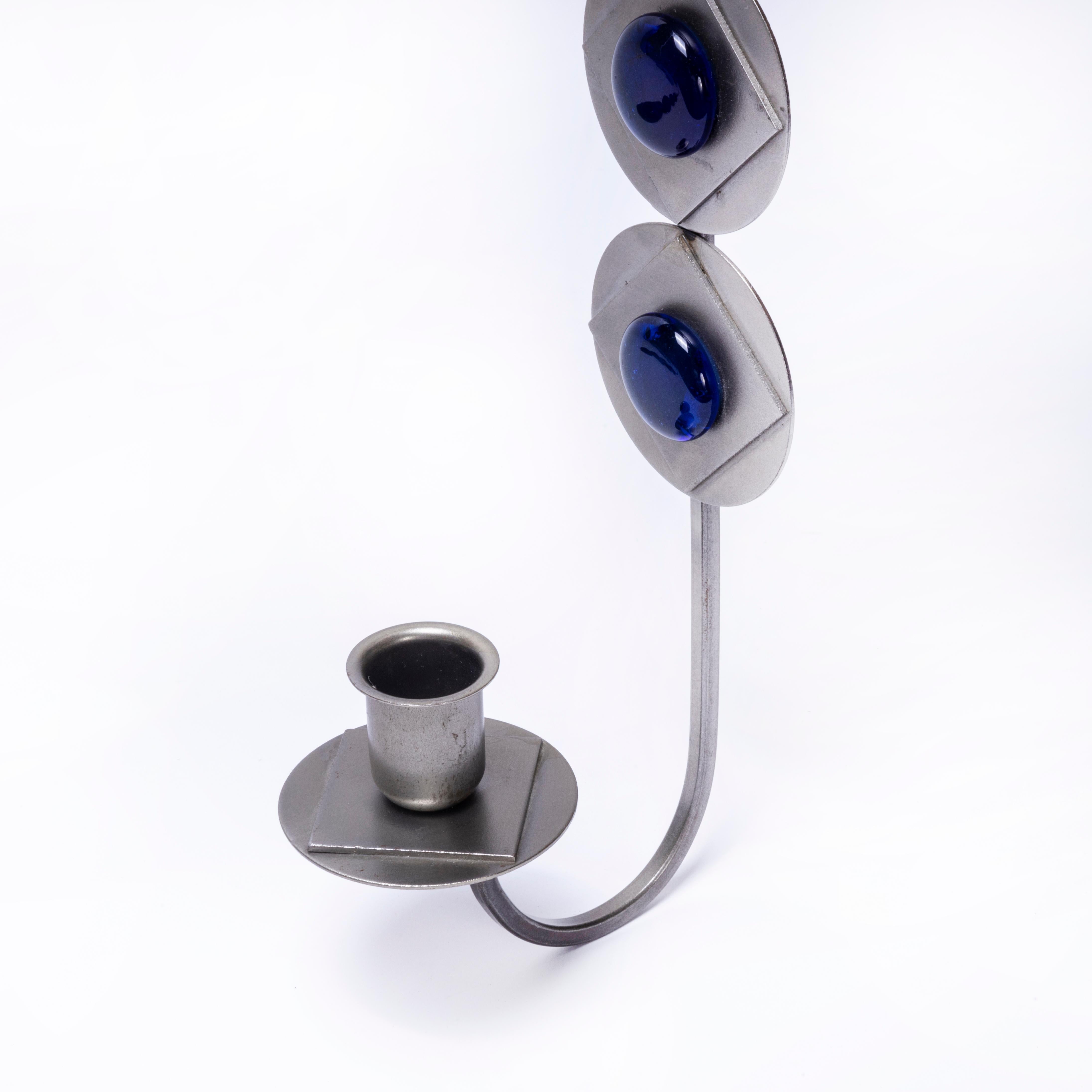 1970's Pair Scandinavian Wall Sconces Metal And Blue Glass. 

These are in excellent condition, no chips, cracks or faults.

Workshop Report:
Our workshop team inspect every product and carry out any needed repairs to ensure that everything leaves