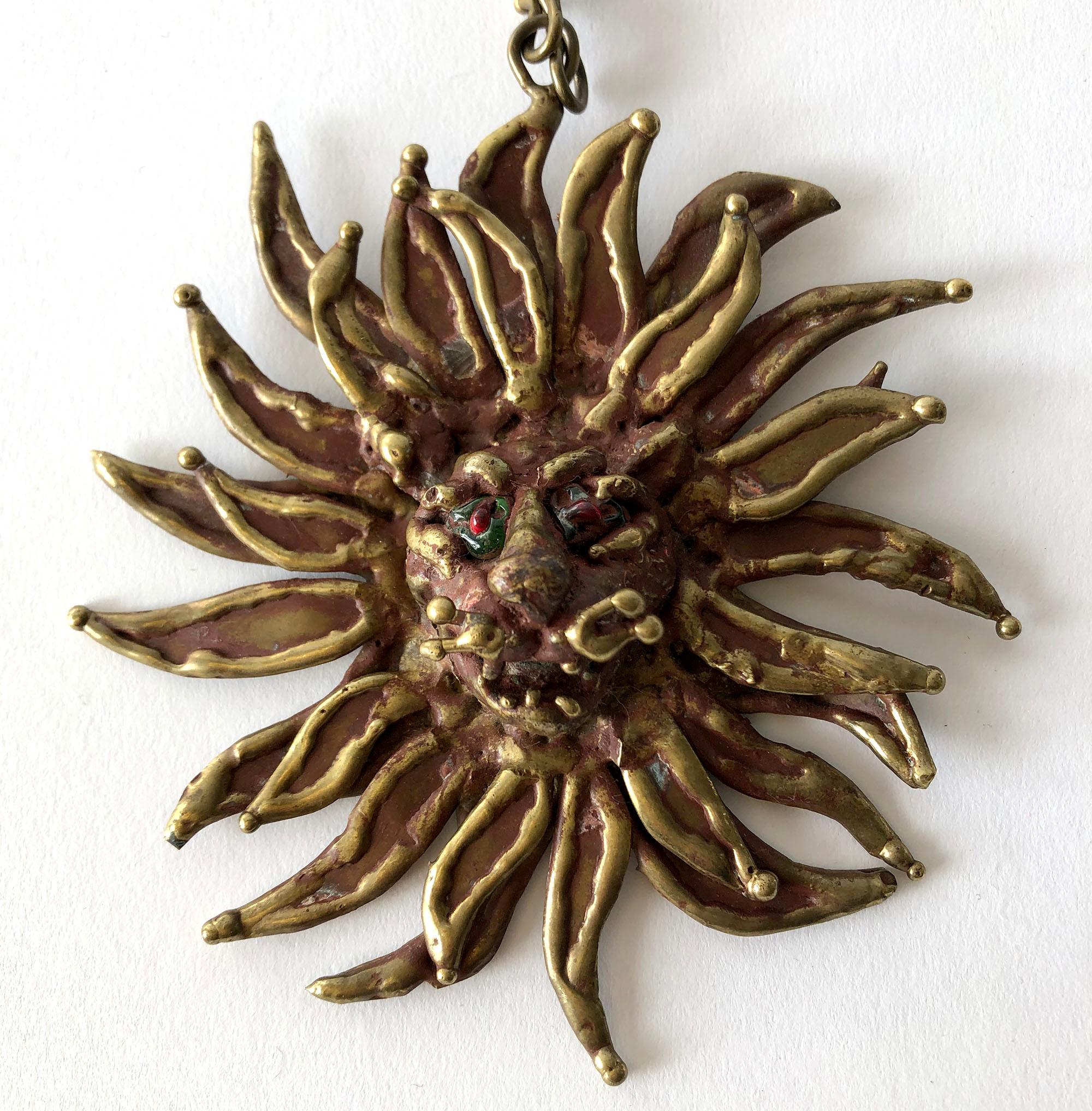 1970's Bronze lion necklace with sun-ray like mane and glass eyes created by Pal Kepenyes of Acapulco, Mexico.  Pendant measures 5
