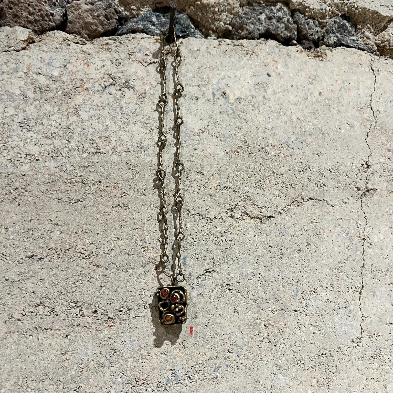 AMBIANIC presents
1970s Pal Kepenyes Brutalist Necklace Brass Mexico
10 h 9.75 chain .5 d x 1 w
preowned vintage 
Refer to images