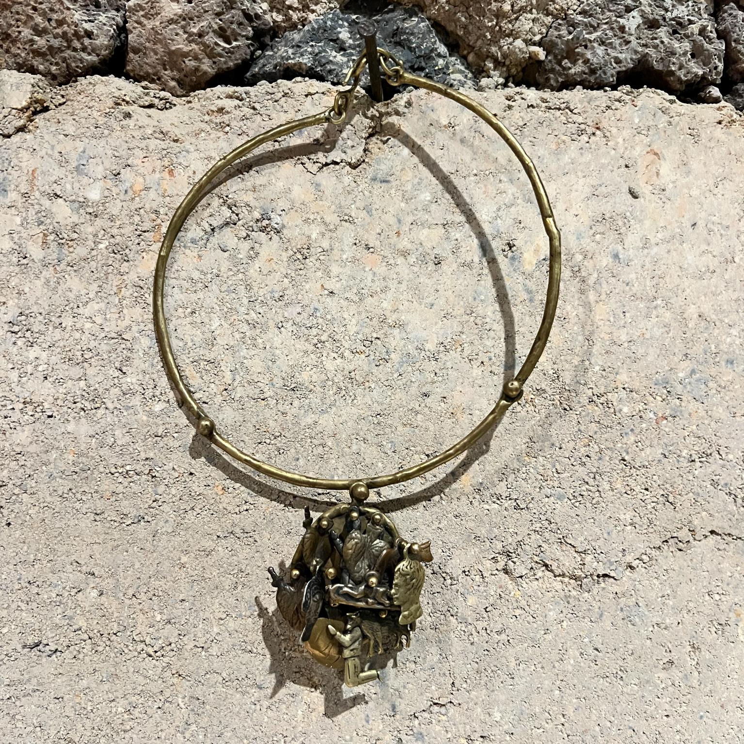AMBIANIC presents
1970s Pal Kepenyes Brutalist Brass Necklace Milagros Series
Brutalist inspired
Signed by artist designer
8.5 h x 5.5 w x .5
Preowned vintage condition
Refer to images