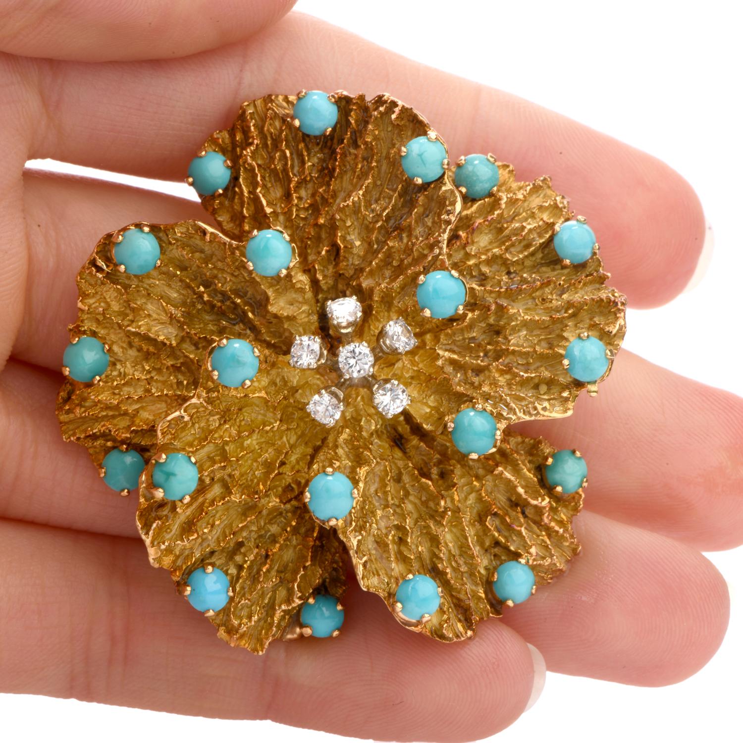 A flower of any kind warms the heart.

This vintage brooch 1970's  was inspired in a Pansy flower motif and 

crafted in 52.4 grams of 18K yellow gold.

The center of the flower contains 5 round brilliant cut diamonds prong set and 

weighing appx.