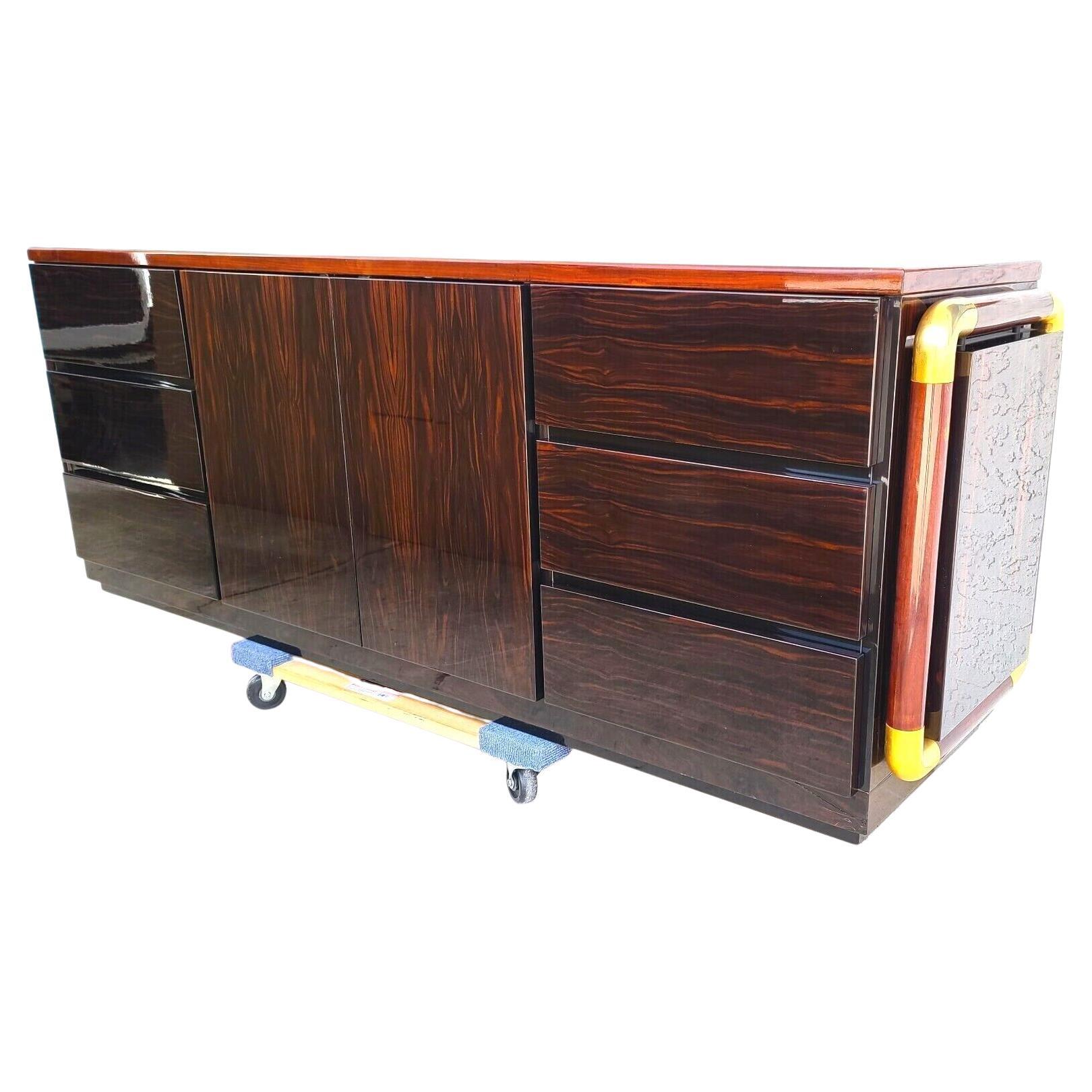 Offeringone of our Recent Palm Beach Estate Fine Furniture Acquisitions Of A
MCM 1970s Italian Lacquered & Brass Sideboard Buffet Bar attributed to PAOLO BARRACHELI
Has 