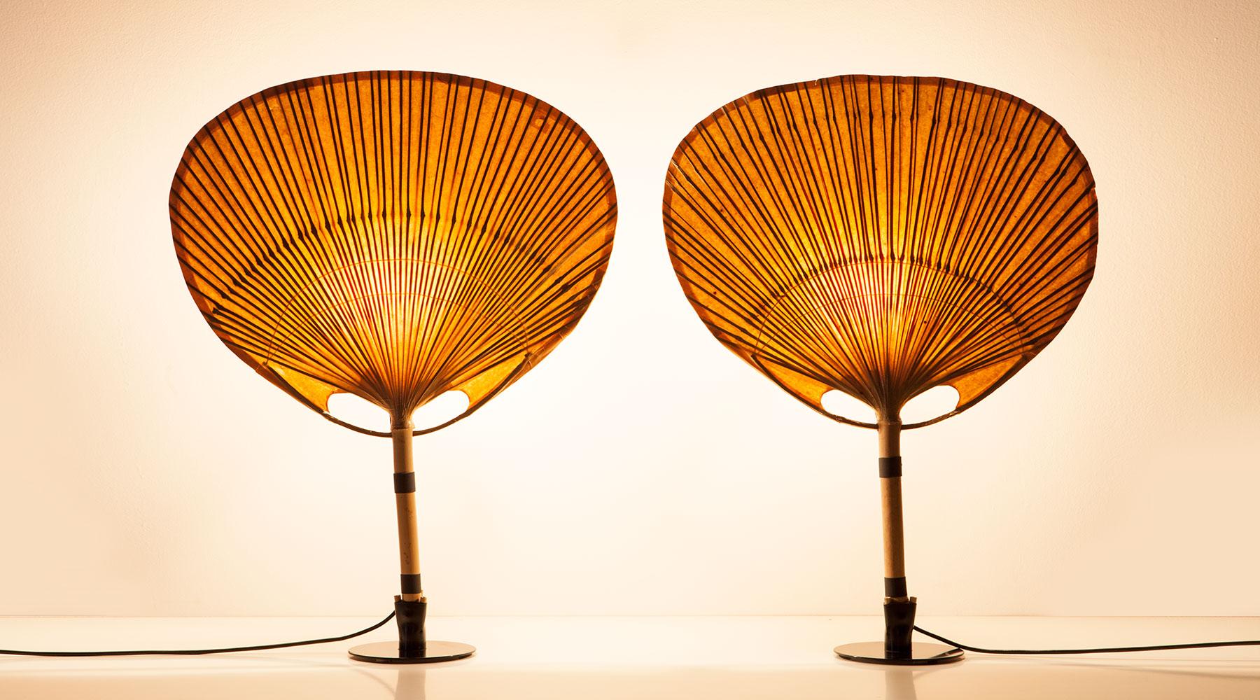 Sculptural table lamps, paper, bamboo and metal details, Germany, 1973.

Delicate 1970s bamboo and paper table lamps by Ingo Maurer. The beautiful construction is held by more solid metal feet, contrasting the light feel of the upper part.