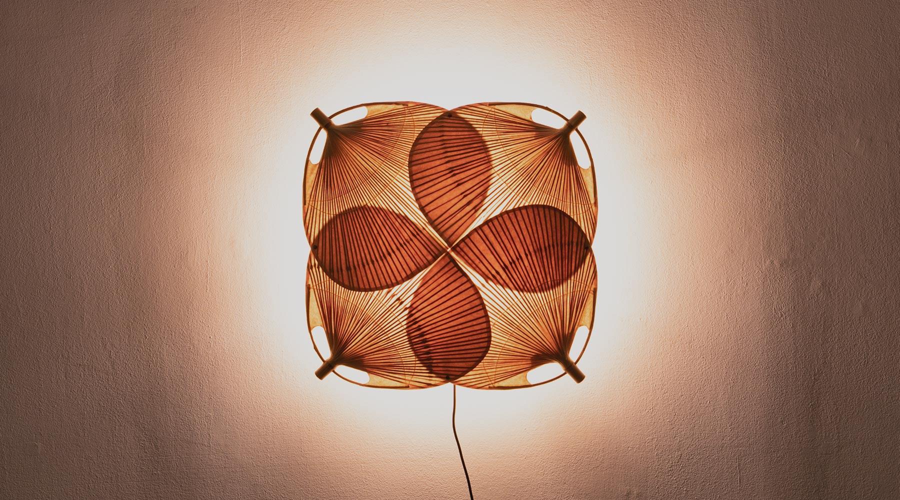 Very rare sculptural wall or ceiling lamp. Paper, bamboo and metal details, Germany, 1973.

Delicate bamboo and paper wall or ceiling lamp from the 1970s by Ingo Maurer. The beautiful construction is held in place by a more solid metal construction,